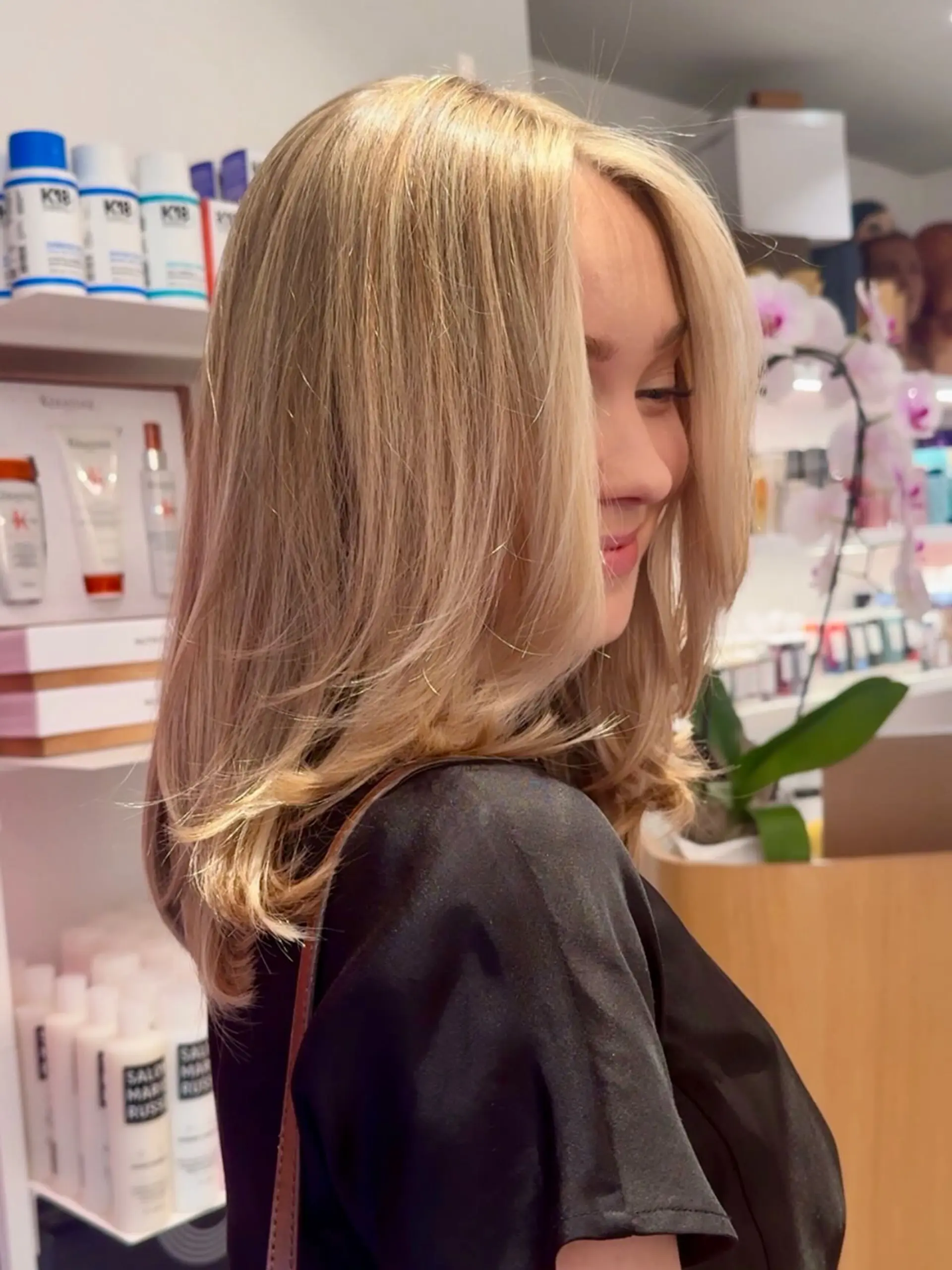 Medium-length warm blonde hair with soft, face-framing layers styled in a voluminous blowout. 1