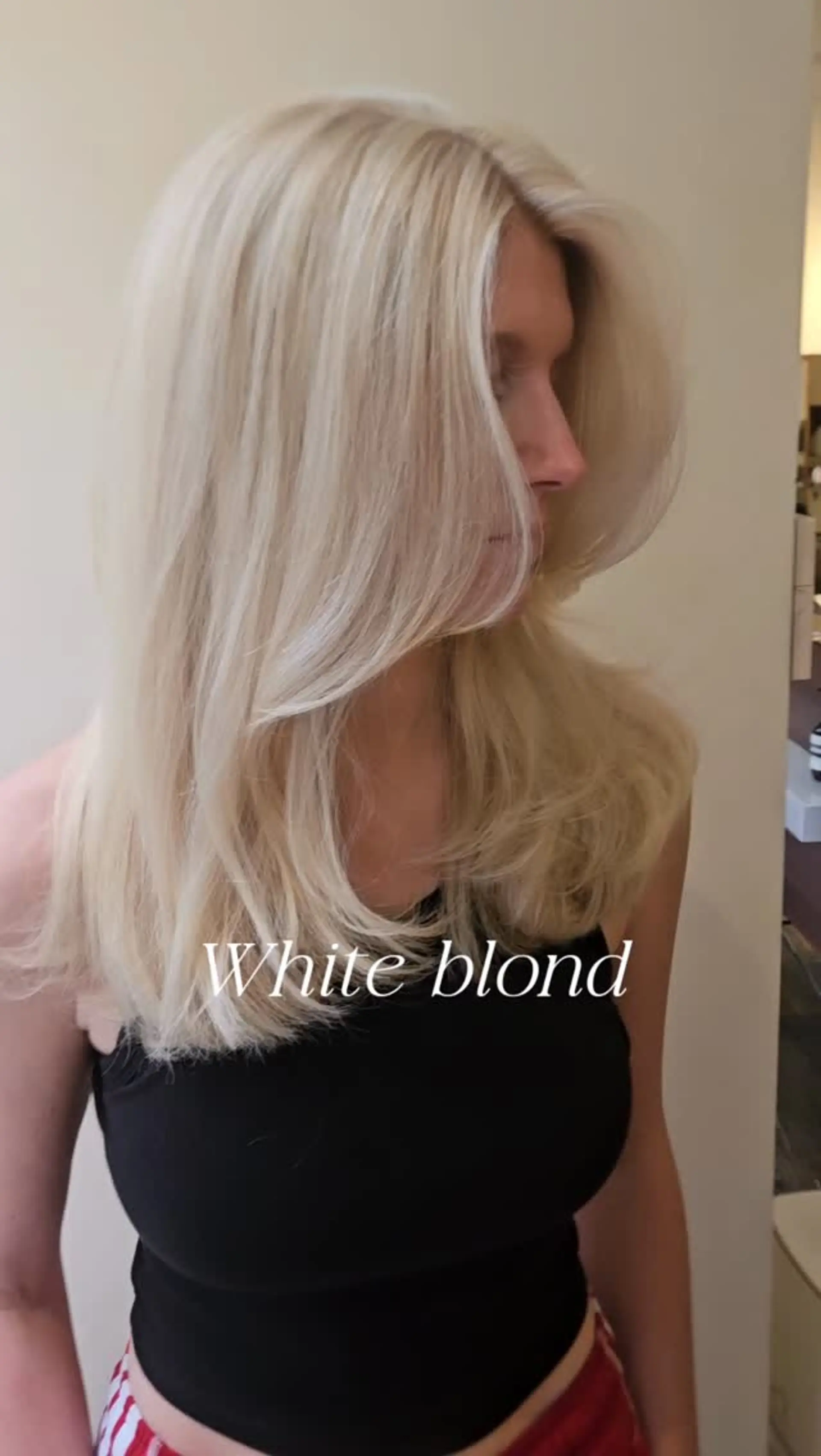 Bright platinum white blonde hair styled into a soft blowout with sweeping face-framing layers. 1
