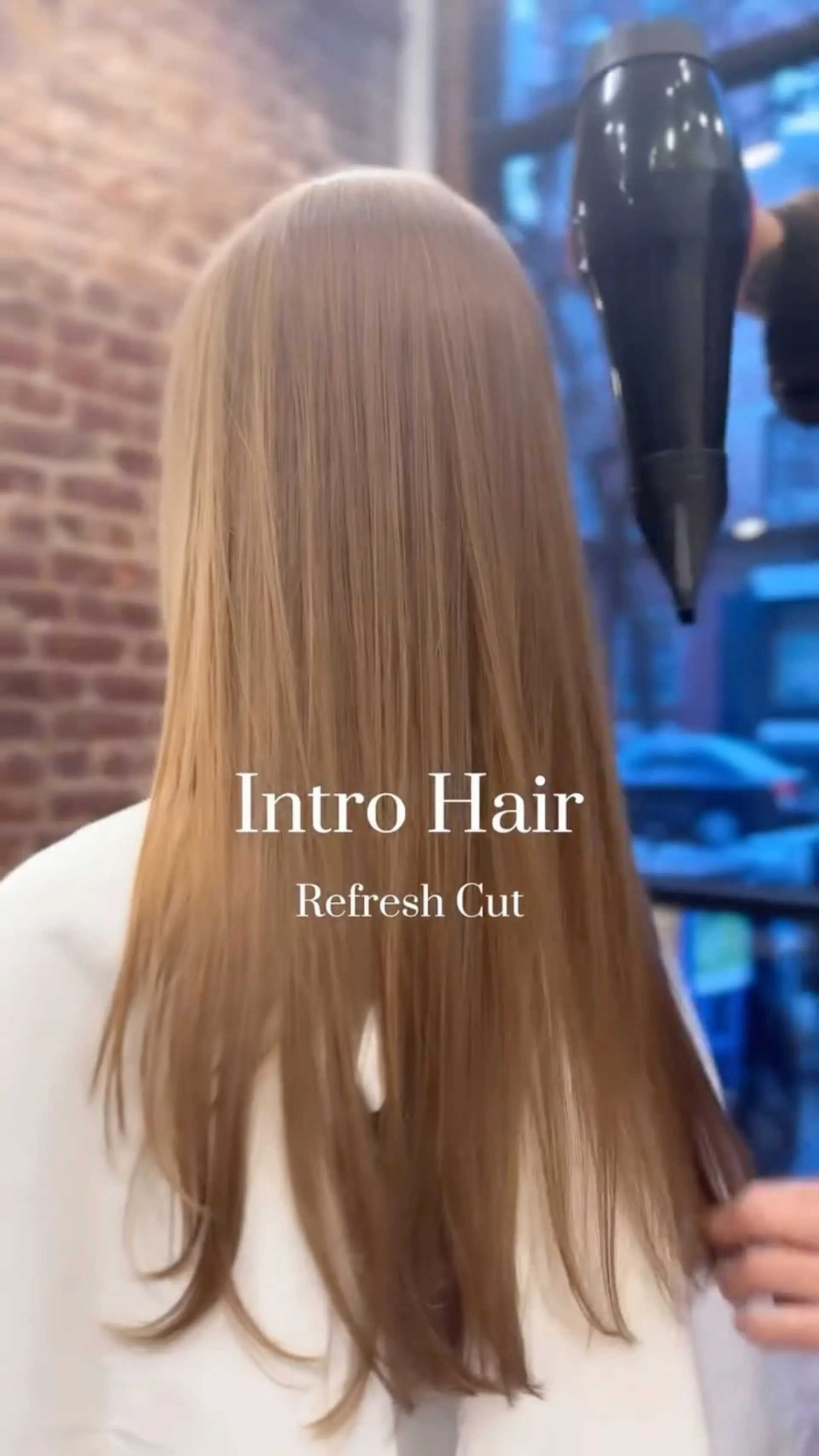 Long, silky straight hair with subtle layered ends, styled smooth with a round brush blowout. 1