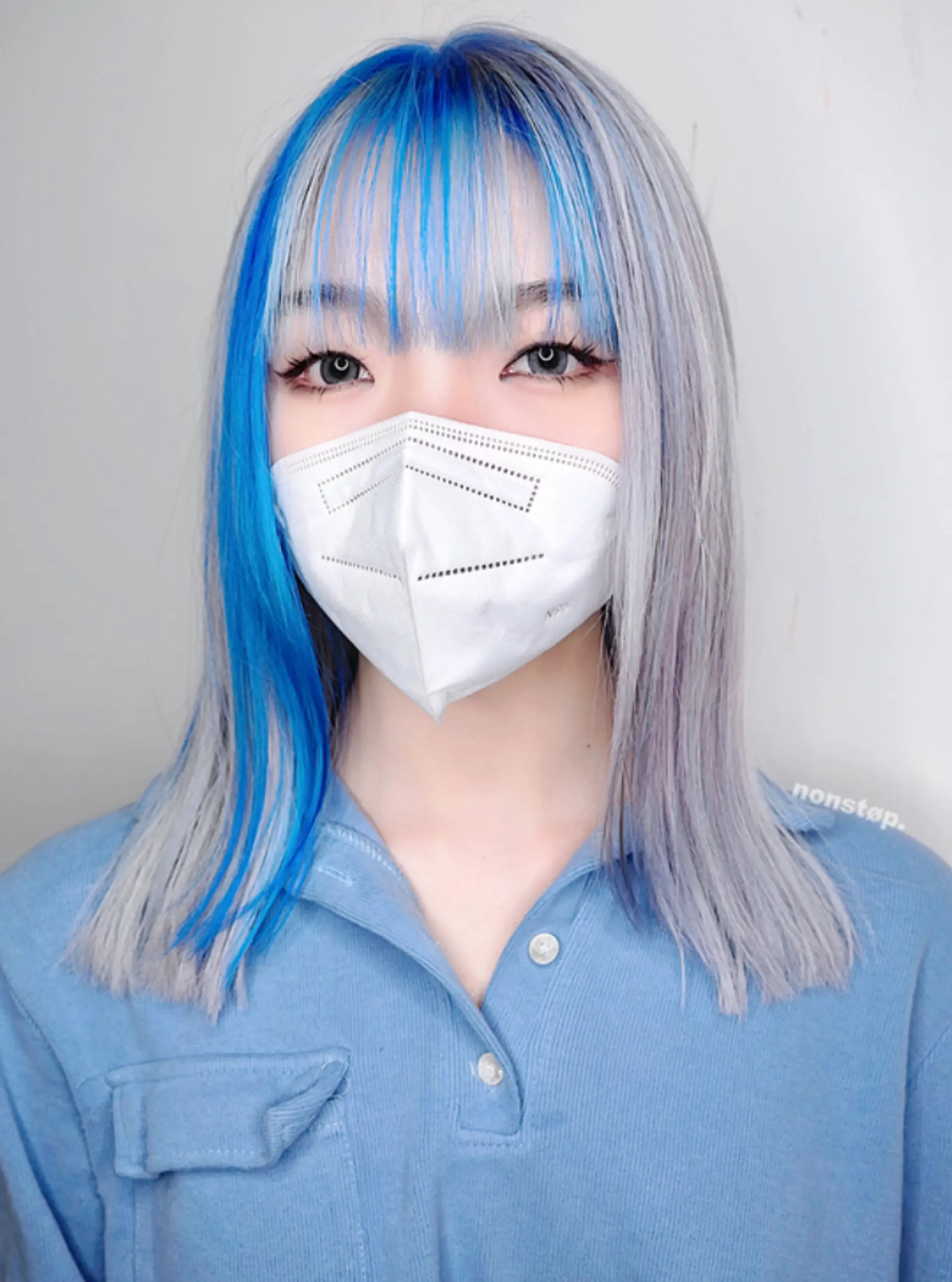 Medium-length, straight hair in bold blue with striking silver and white highlights, featuring a layered cut with a side-part and precision-cut ends.
(NonstopStyle: by Vincent) 2