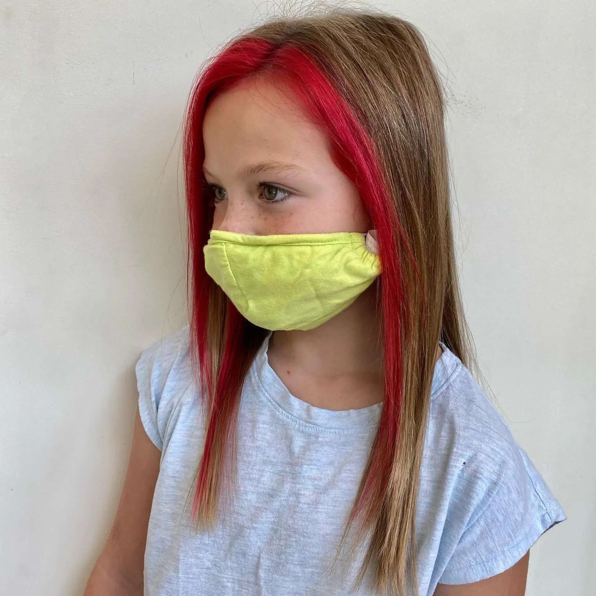 Straight light brown hair accented with bold, vivid pink-red face-framing money piece sections. 1