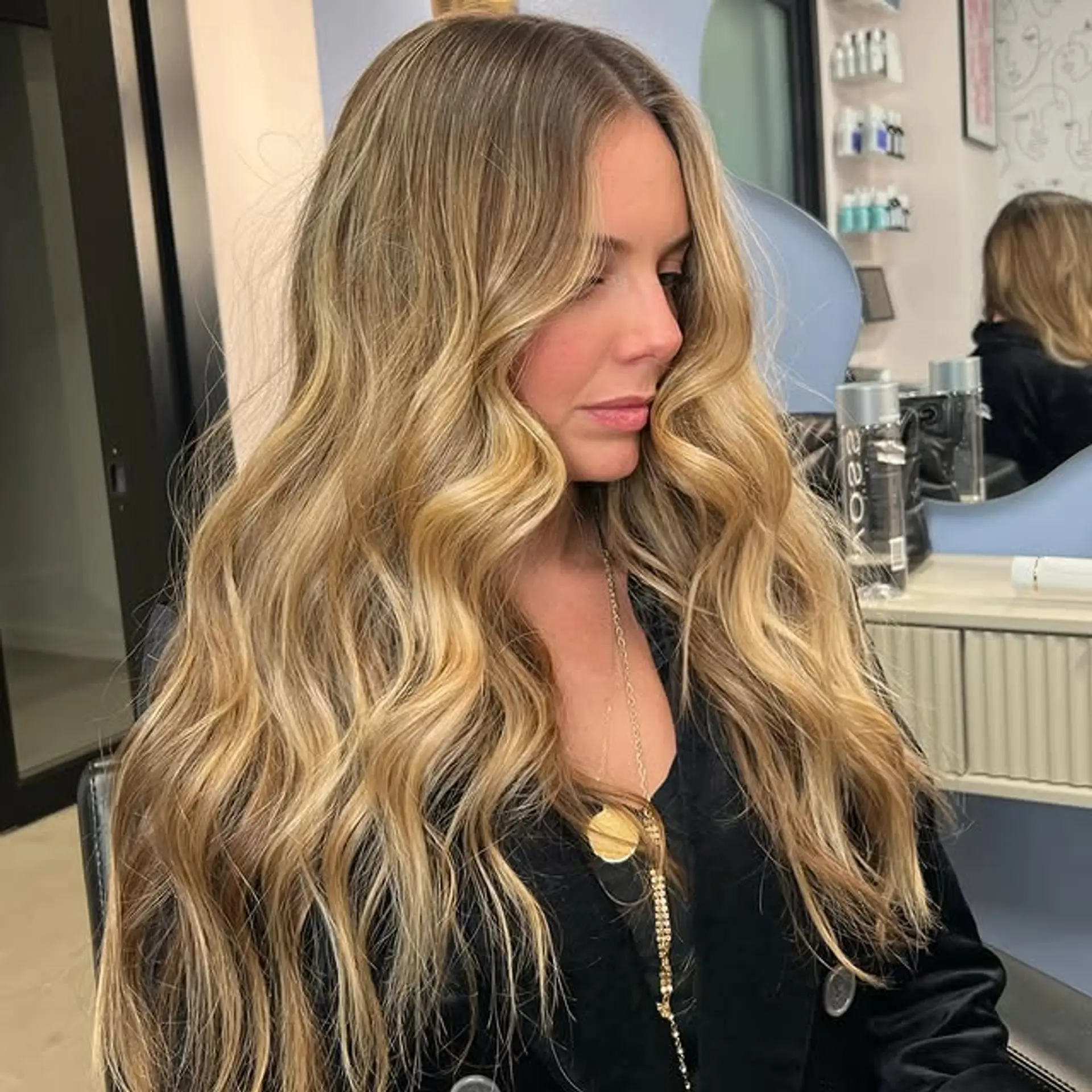 Long, layered waves with a golden blonde balayage. 1