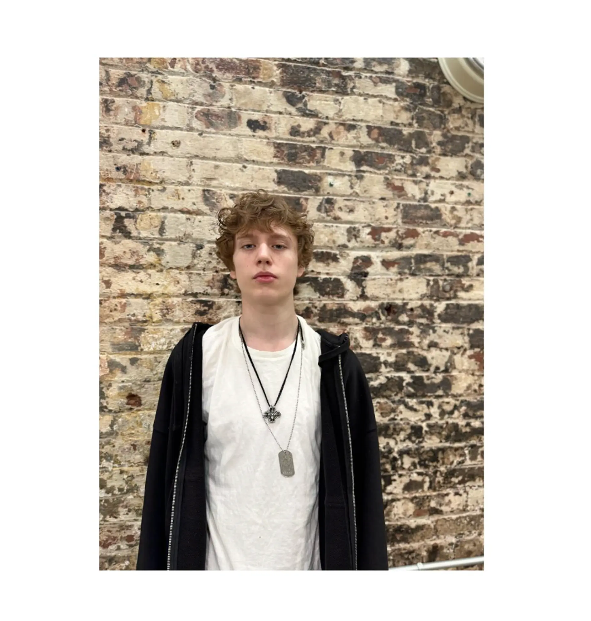 A short, textured crop designed to accentuate natural curls, creating an easy and stylish look. 1