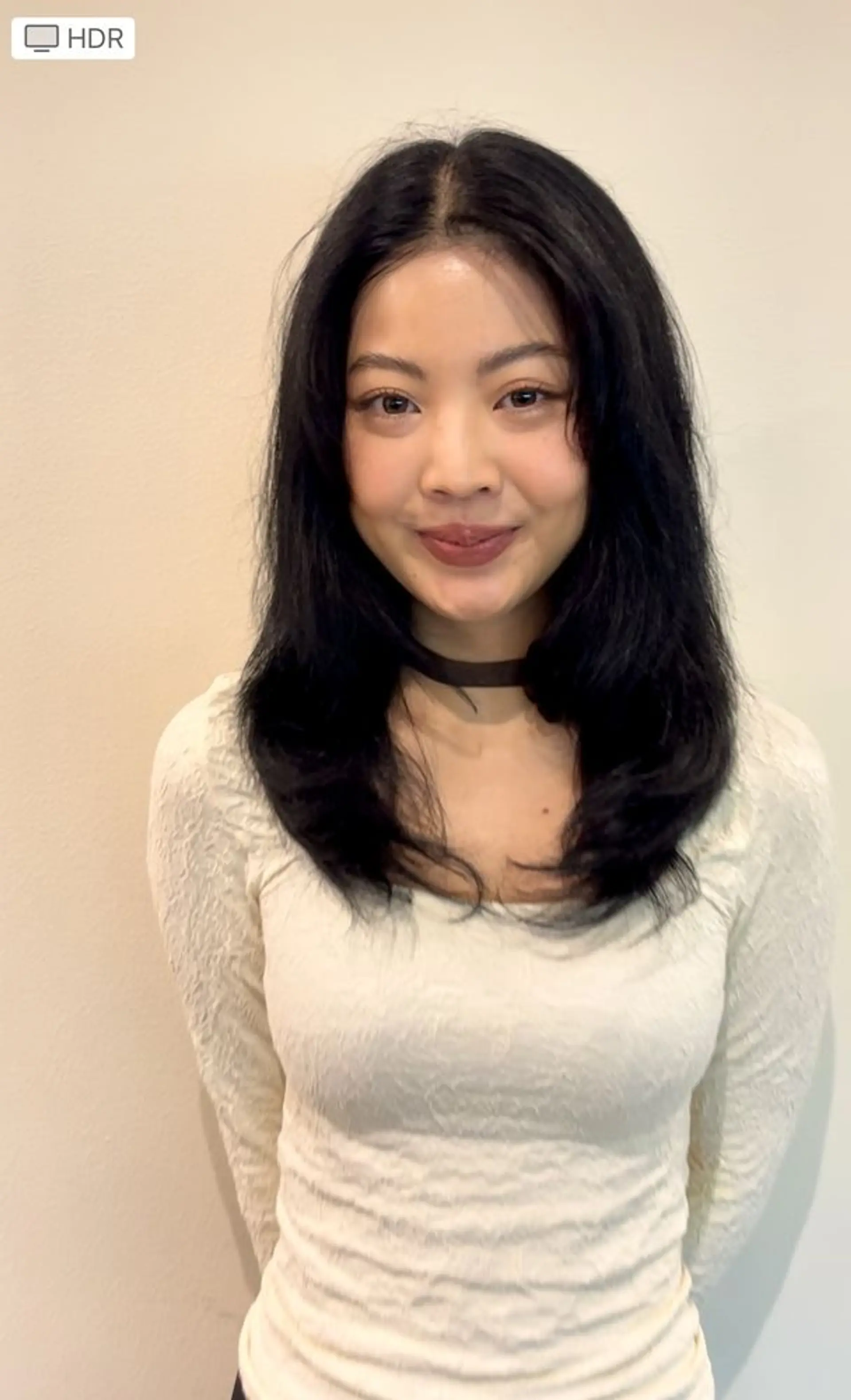 A medium-length layered cut with face-framing curtain bangs and soft, tousled ends. 1