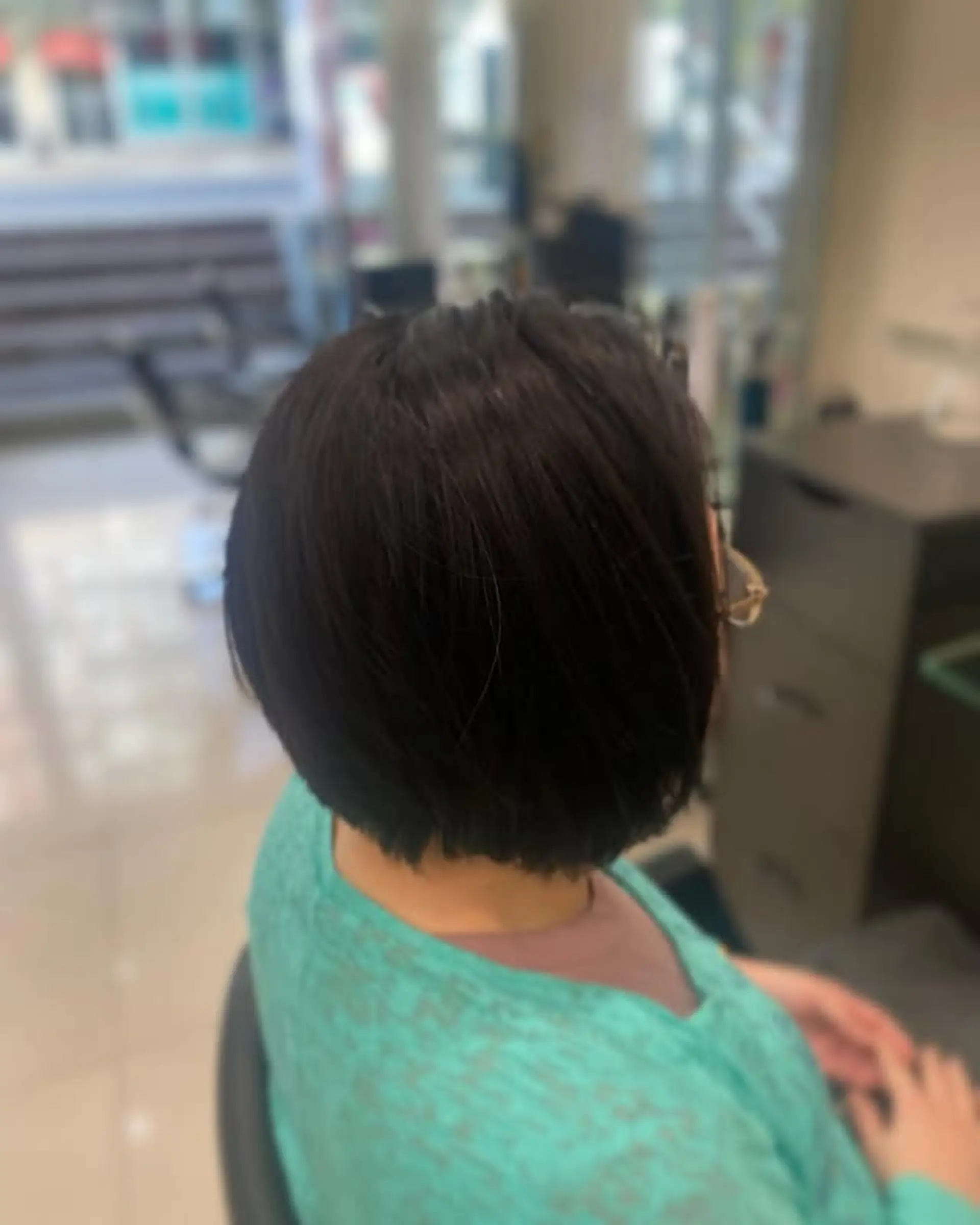 A timeless chin-length bob haircut, featuring a clean and polished look. 1