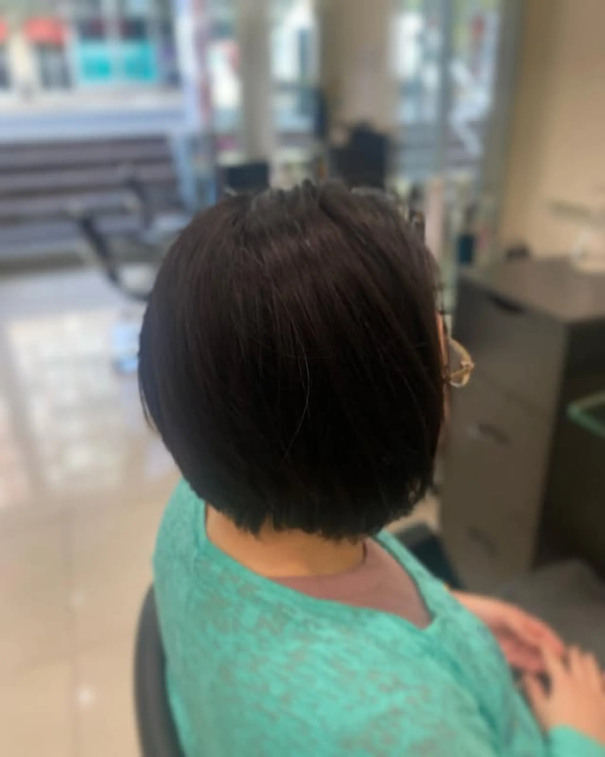 A timeless chin-length bob haircut, featuring a clean and polished look.