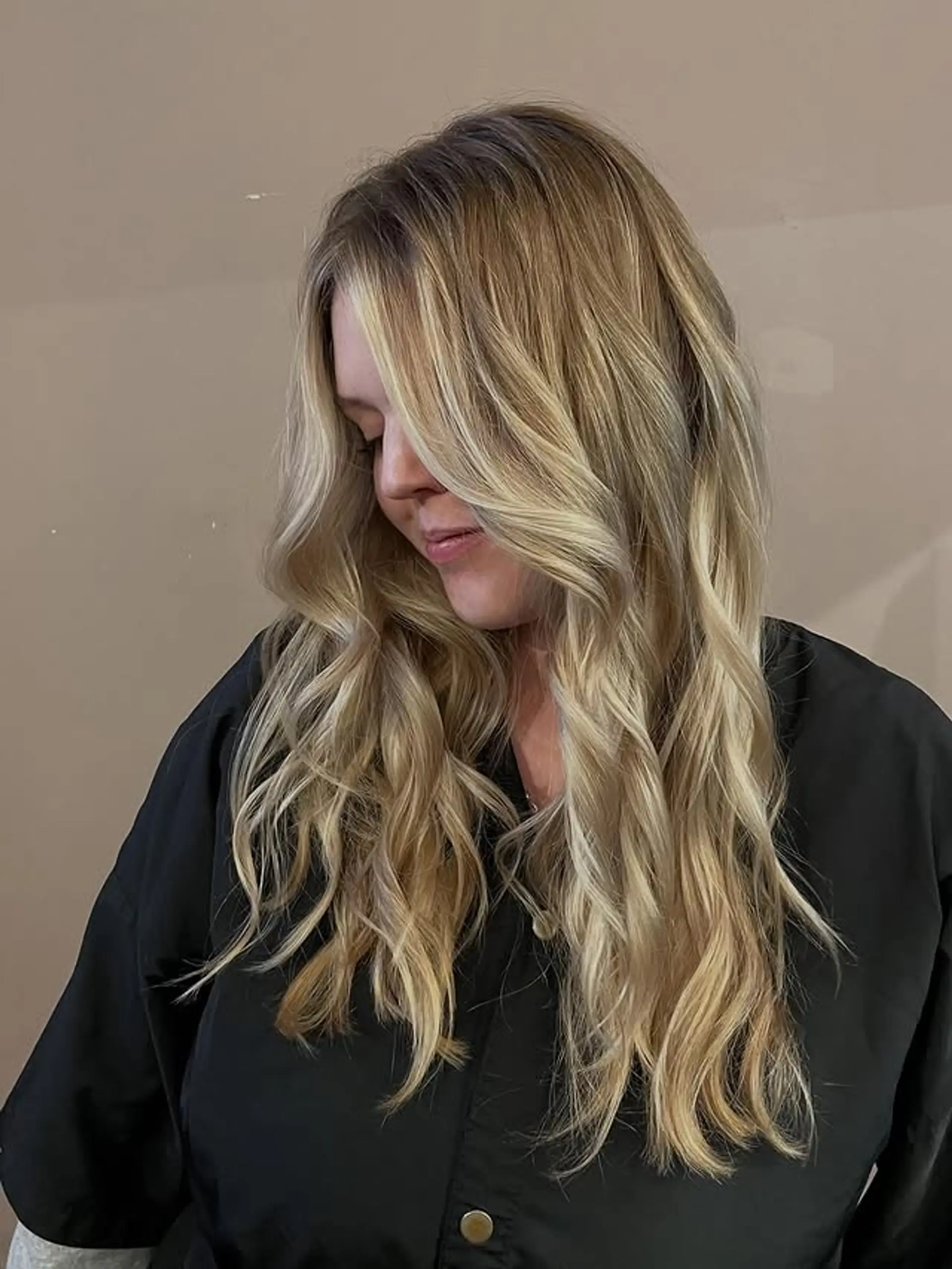 Long, wavy hairstyle with a balayage and beachy waves. 1