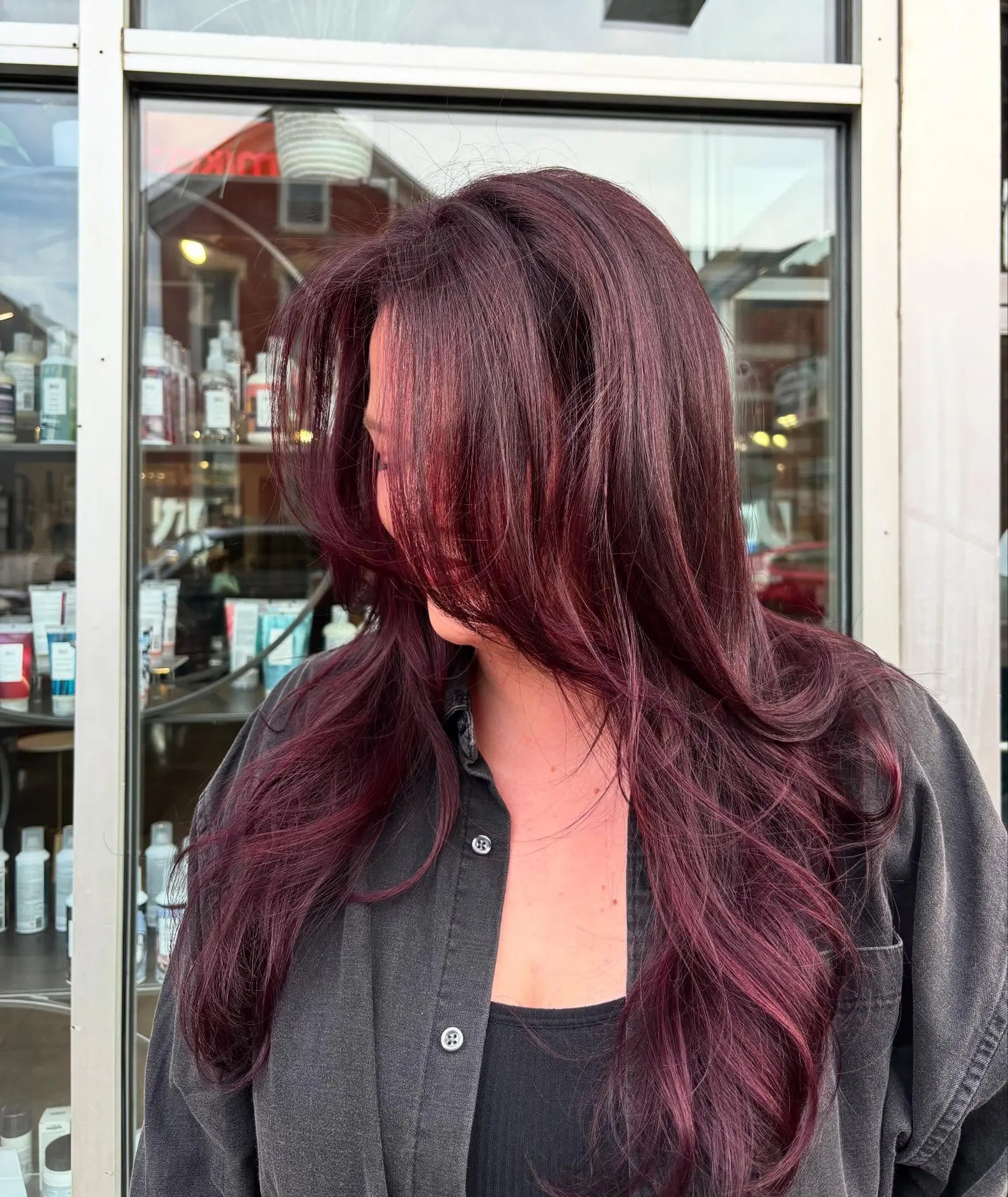 Long, straight hair with a burgundy red balayage and long layers. 1