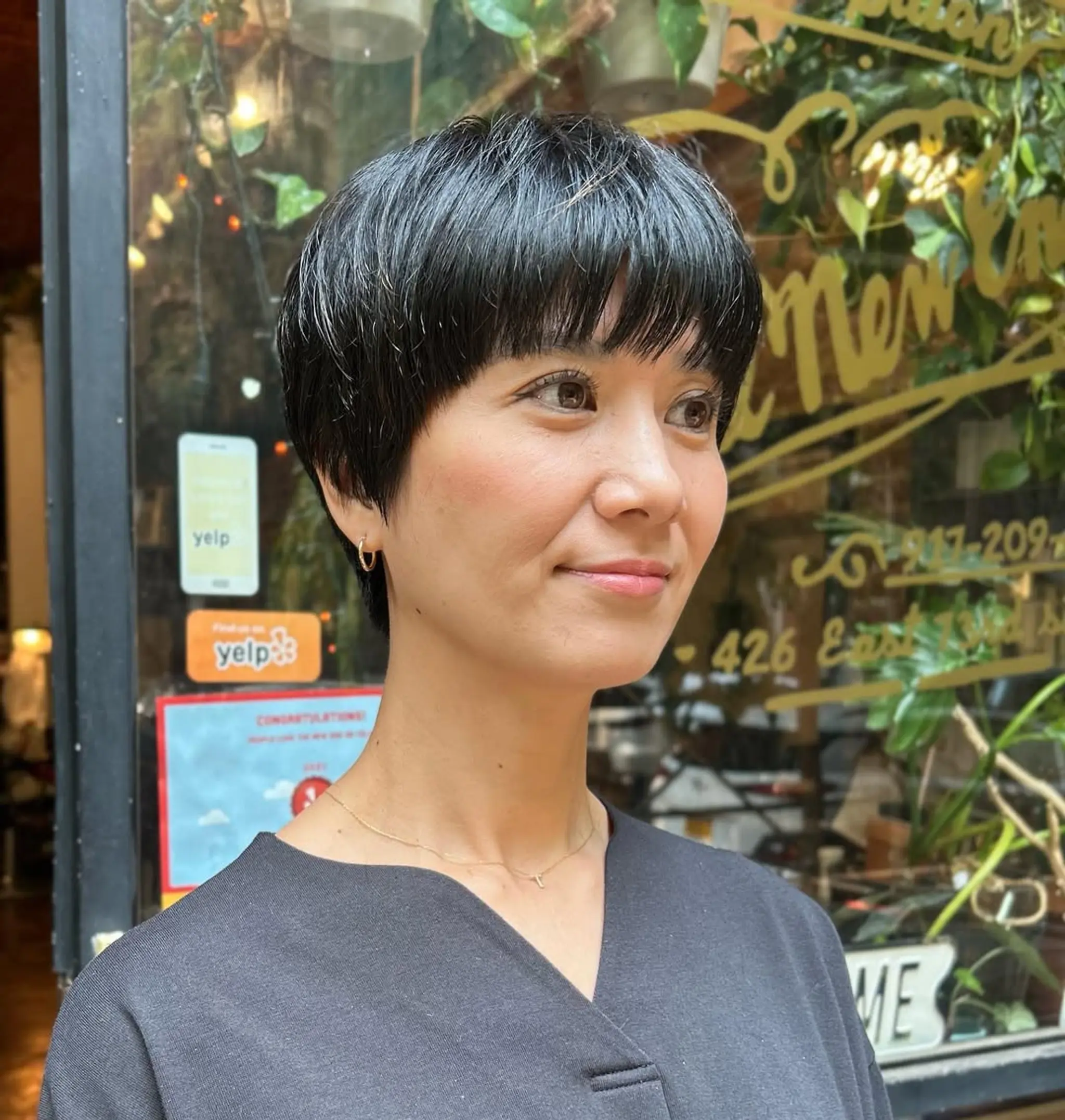 A sleek, short blunt bob with straight-across bangs.
