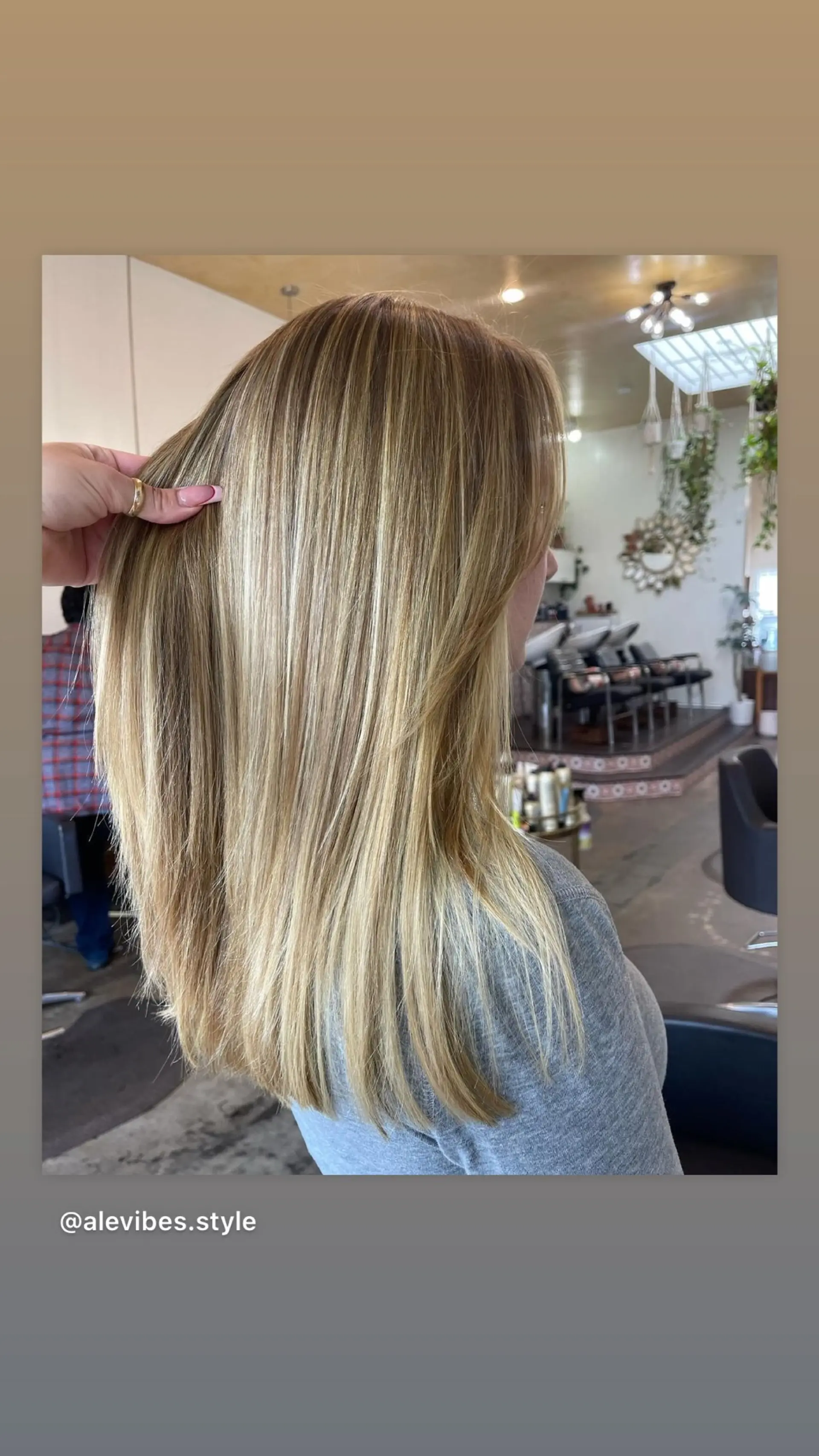 A long, straight hairstyle with a beautiful beachy blonde balayage and flattering face-framing layers. 1