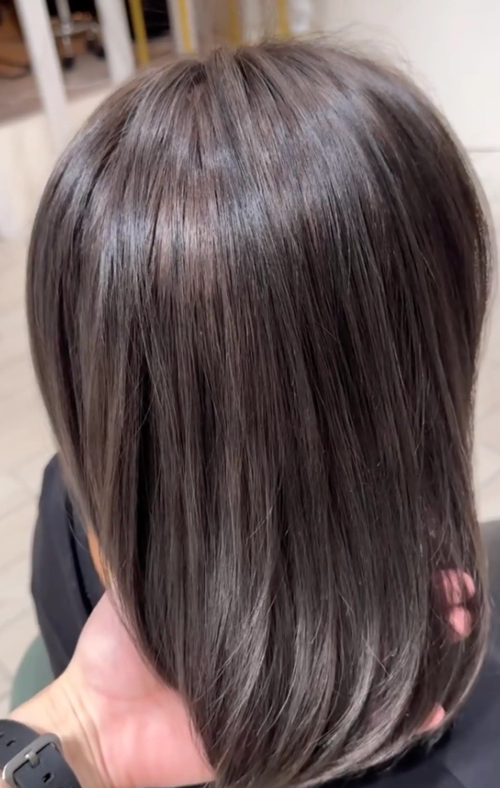Medium-length, straight, and sleek black hair with a glossy shine, perfectly smooth and straightened. 1