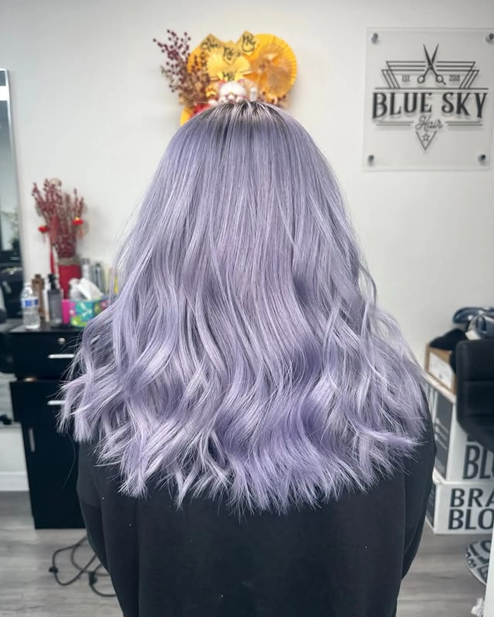 Medium-length wavy hair with a lavender color melt. 1