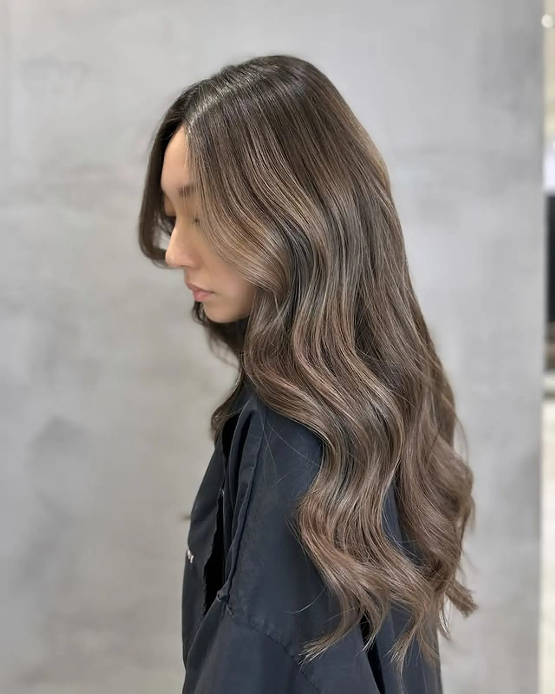 Long, wavy hair with subtle waves and a glossy finish. 1