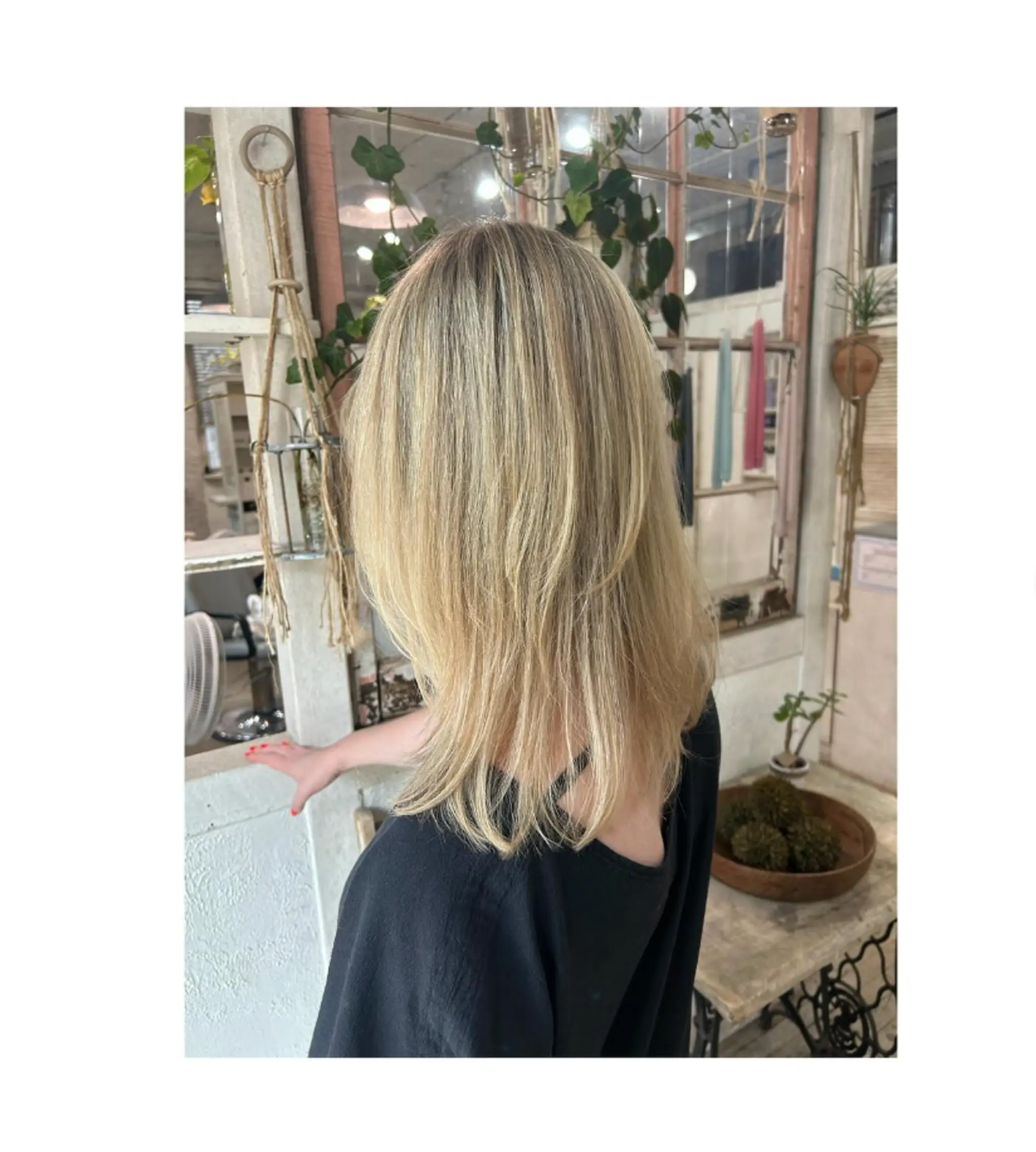 A layered haircut with face-framing layers and a beachy, textured finish.