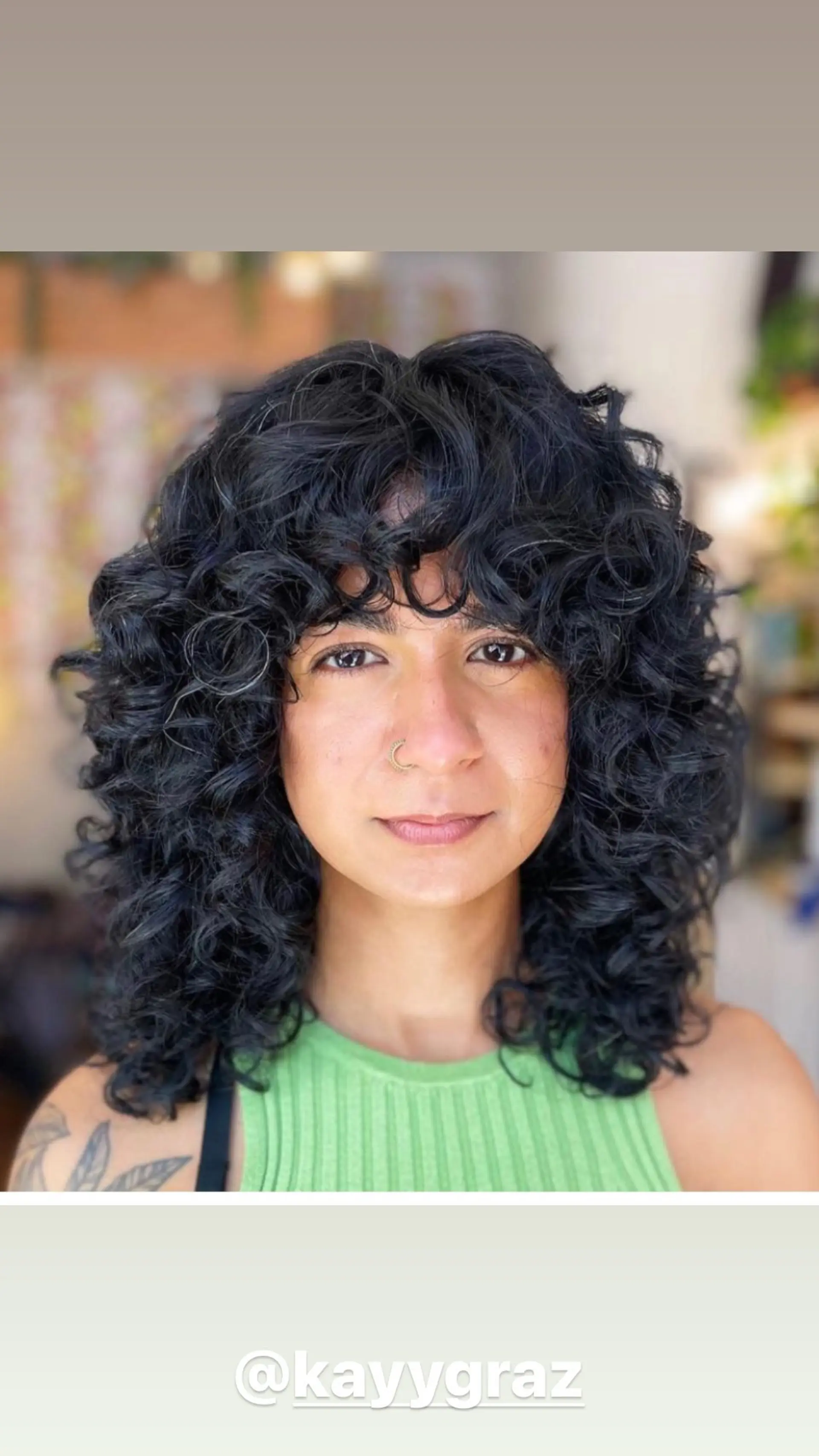 A curly shag with layered curls and a fringe. 1