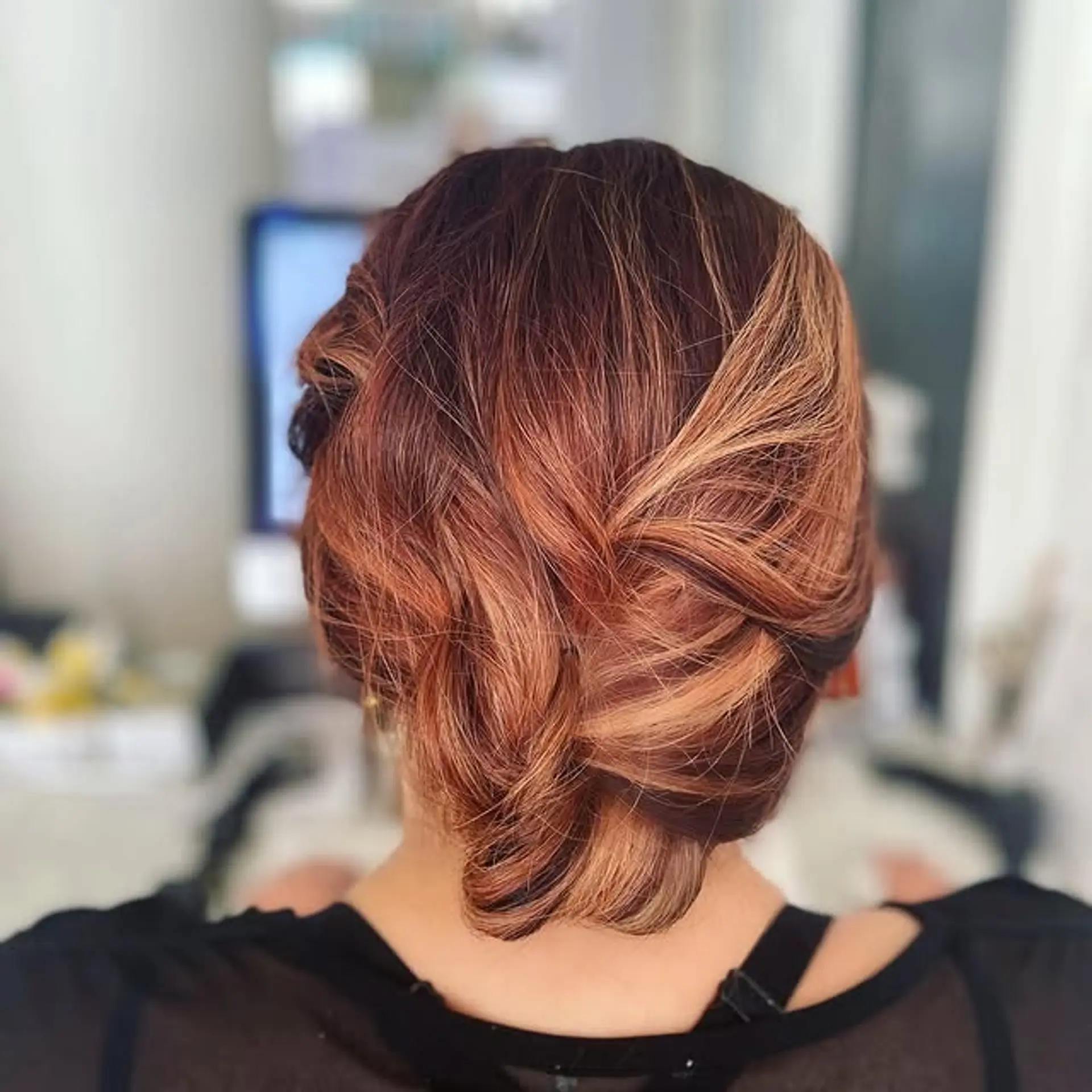 An elegant twisted updo with a romantic and formal appeal. 1