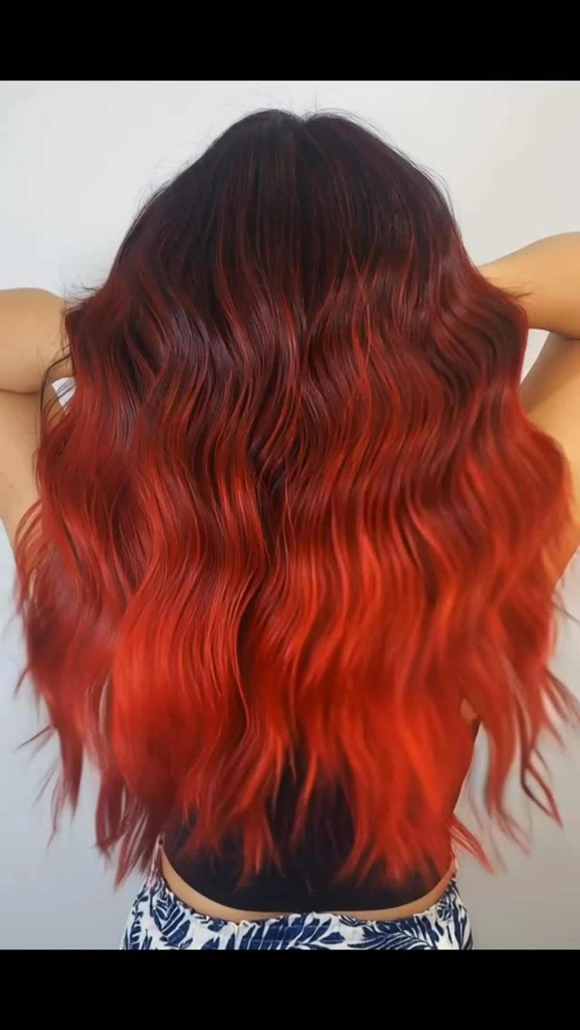 A vibrant fire red foilayage with a dark root melt. 1