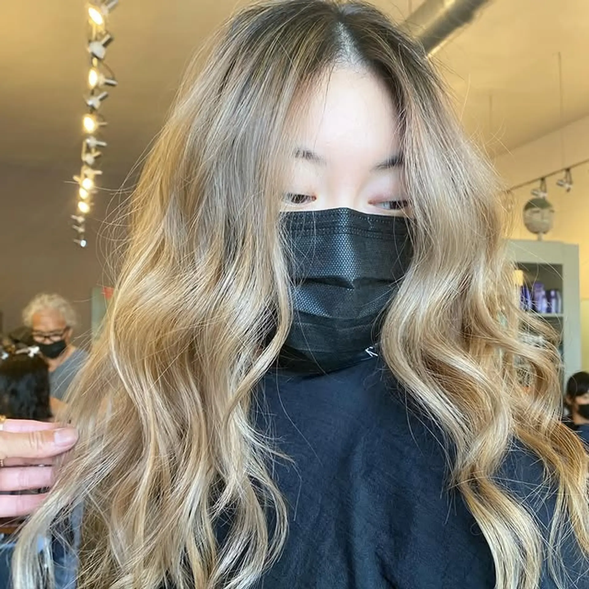 Long wavy hair with a seamless balayage color melt. 1