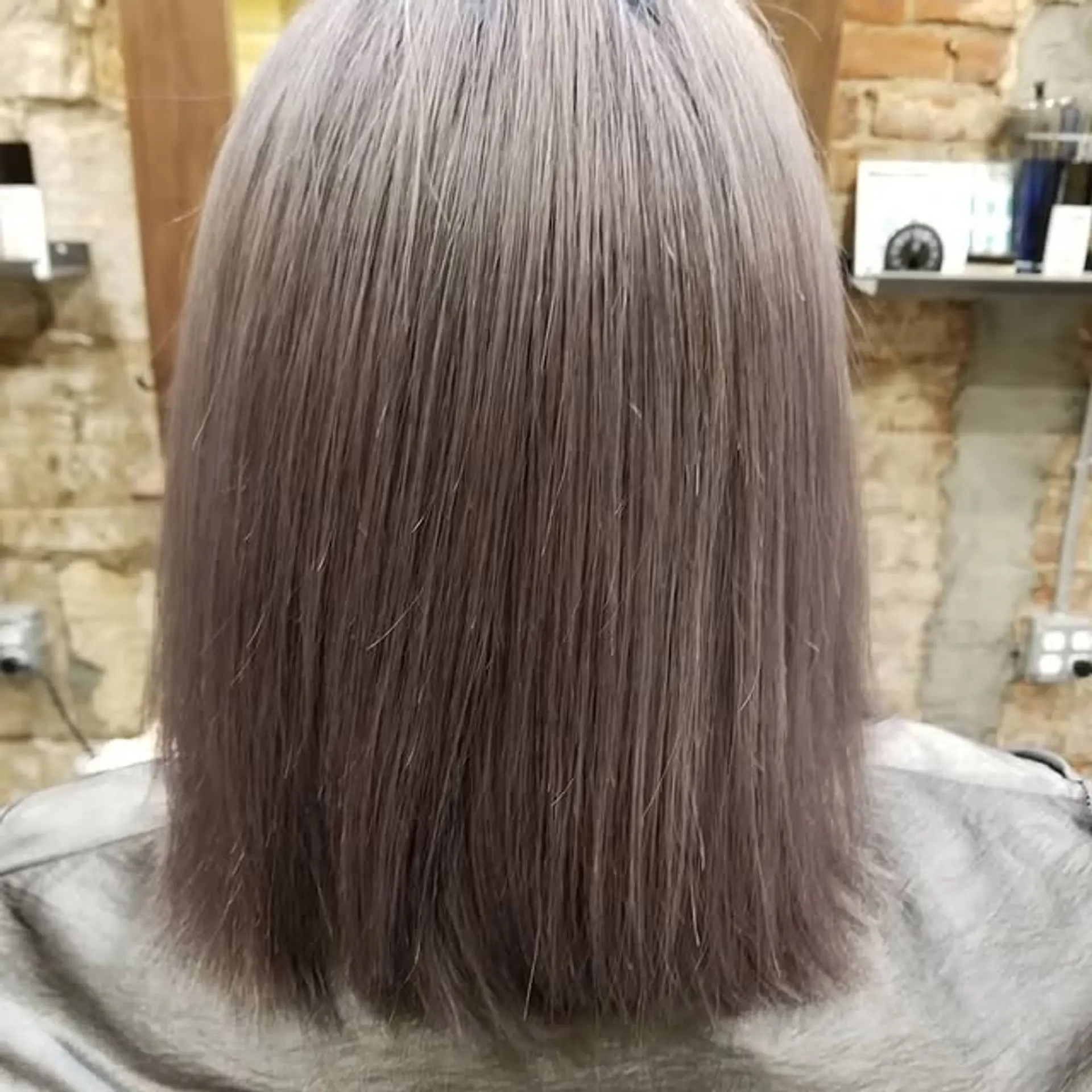 Shoulder-length straight lob with pastel lavender and gray tones. 1