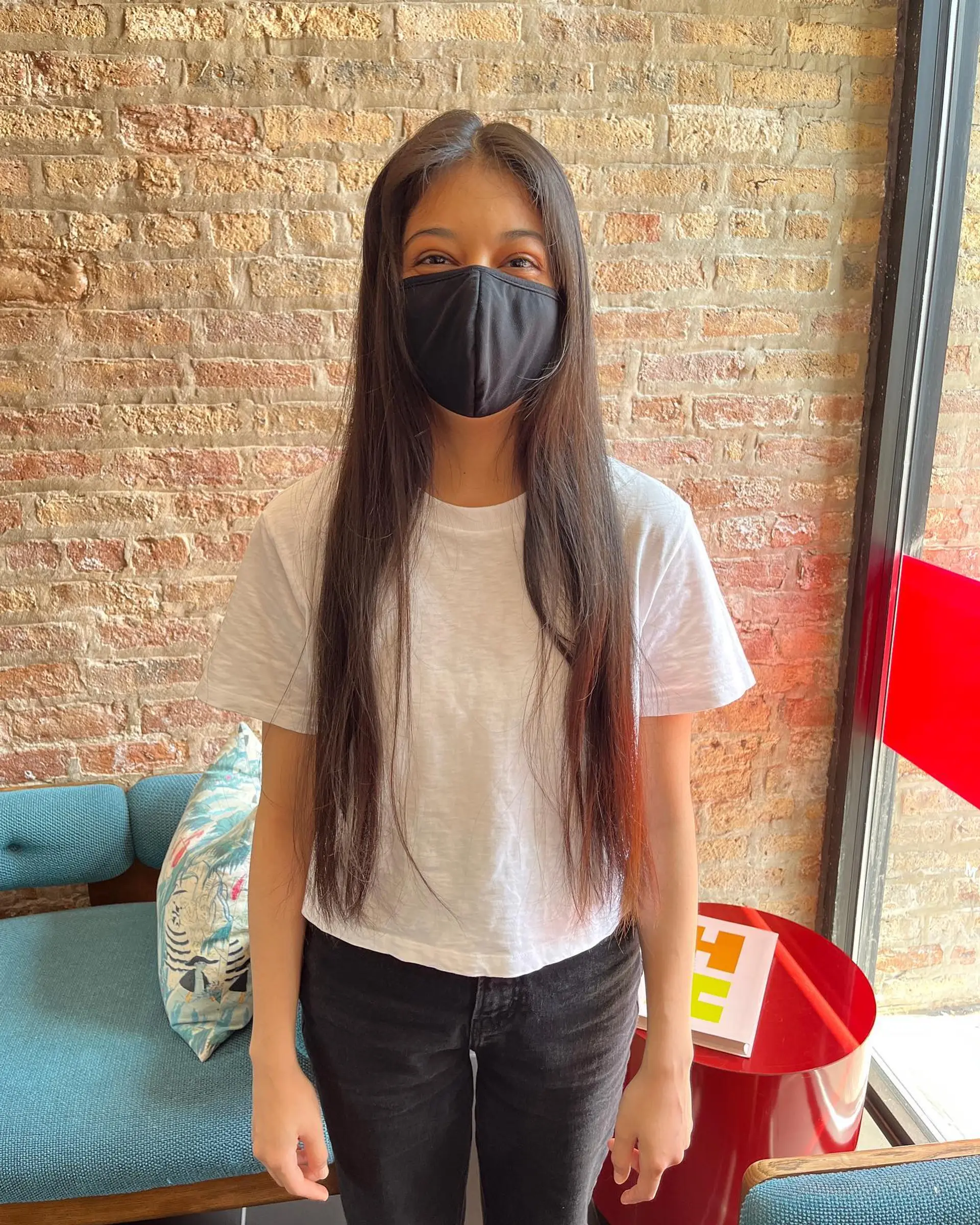 A chic, medium-length layered hairstyle with stylish curtain bangs. 2