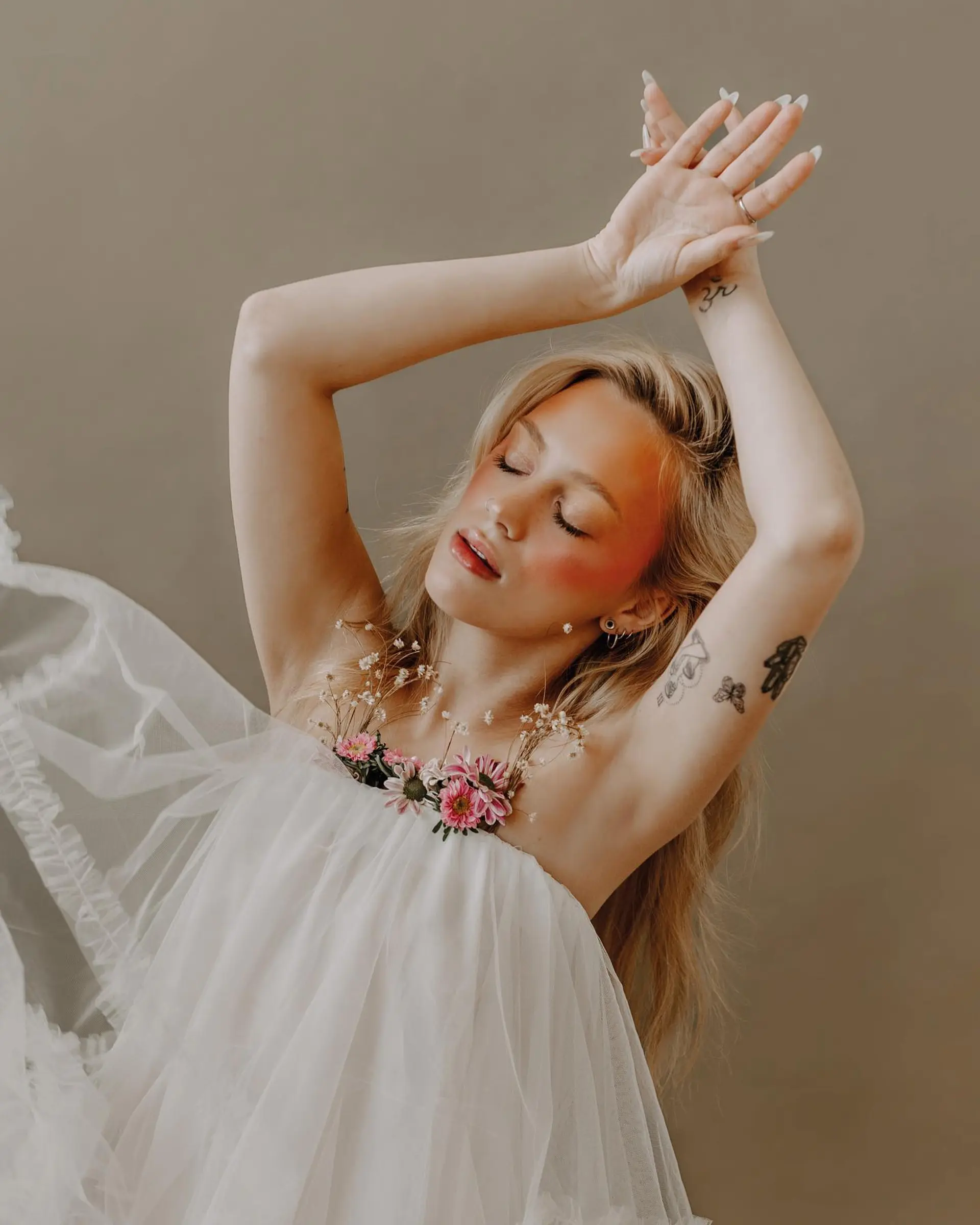 Long honey-blonde hair styled with natural volume and flowing texture for an editorial look. 1