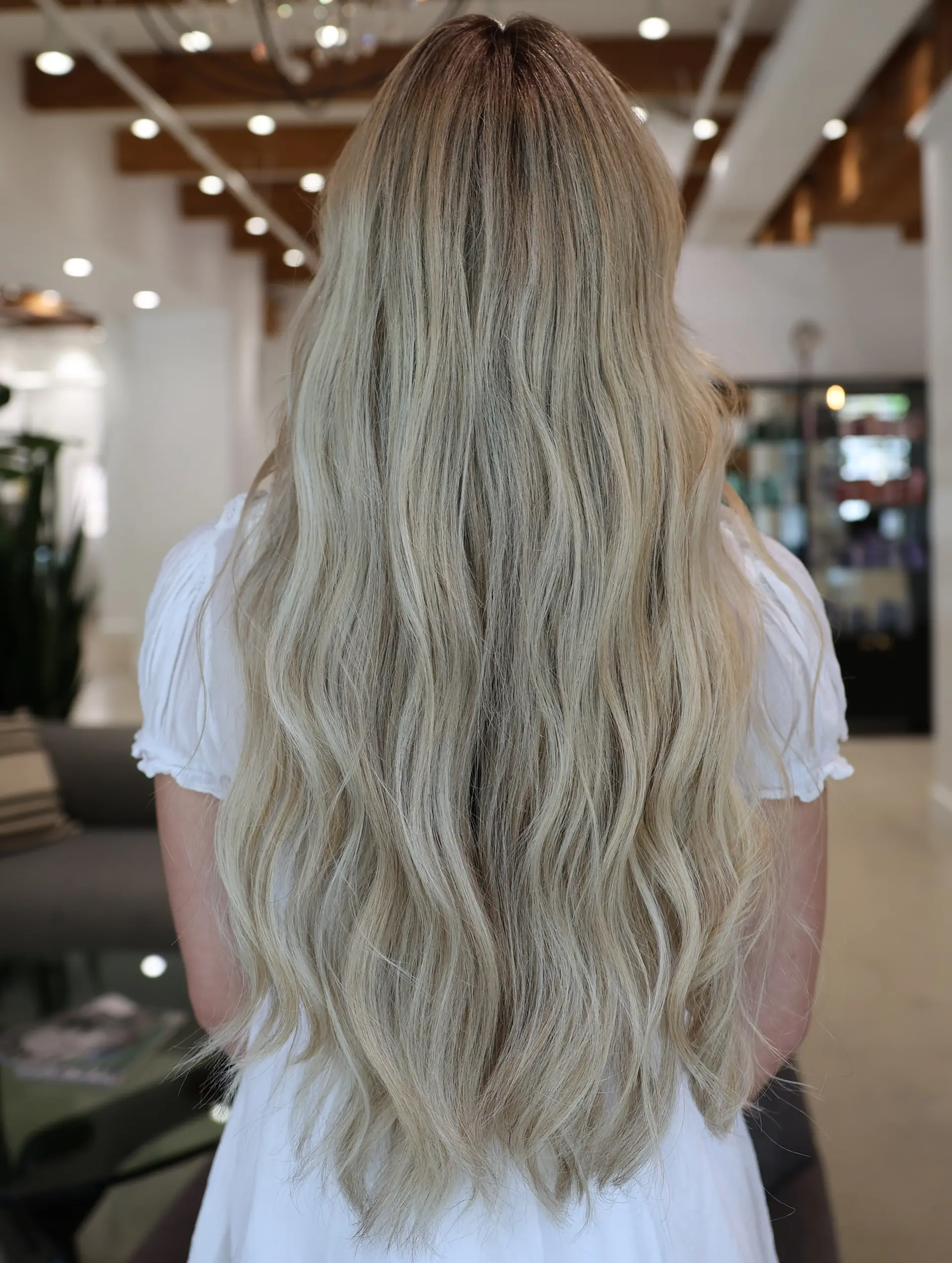 Long, flowing beachy waves with subtle layers and a natural, sun-kissed blonde. 2