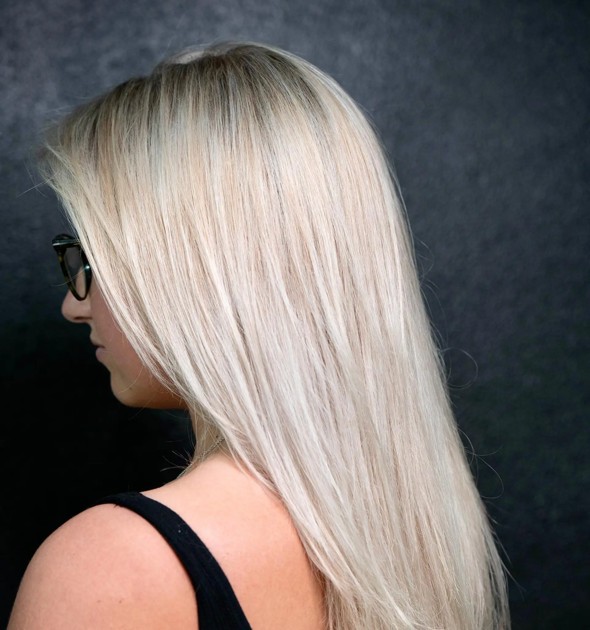 Long, straight hairstyle with a cool-toned platinum blonde color, also known as Icy Blonde. 1