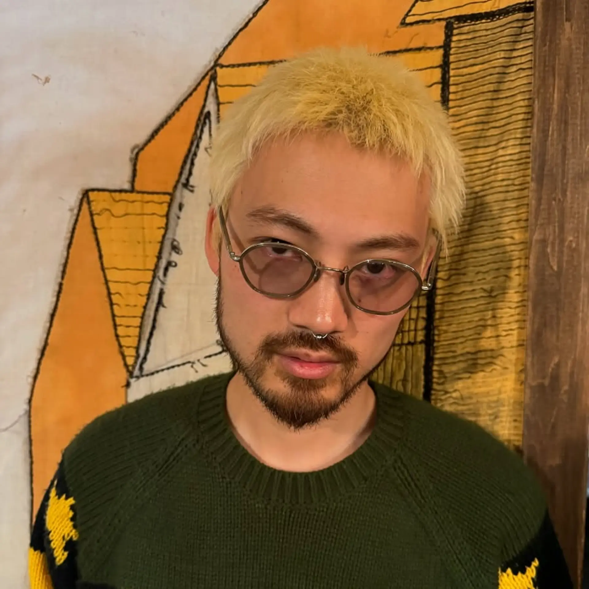 A short, heavily textured, and layered crop featuring a choppy finish and a bright platinum blonde color. 1