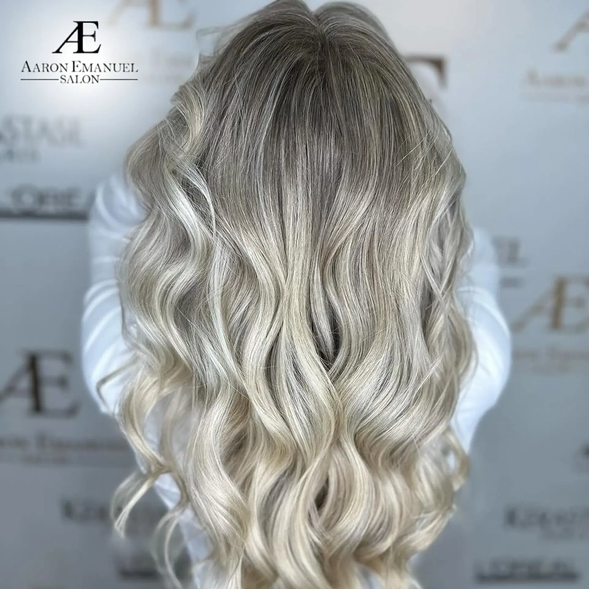 Very long, wavy hair with a beautiful ash blonde and silver balayage. 1
