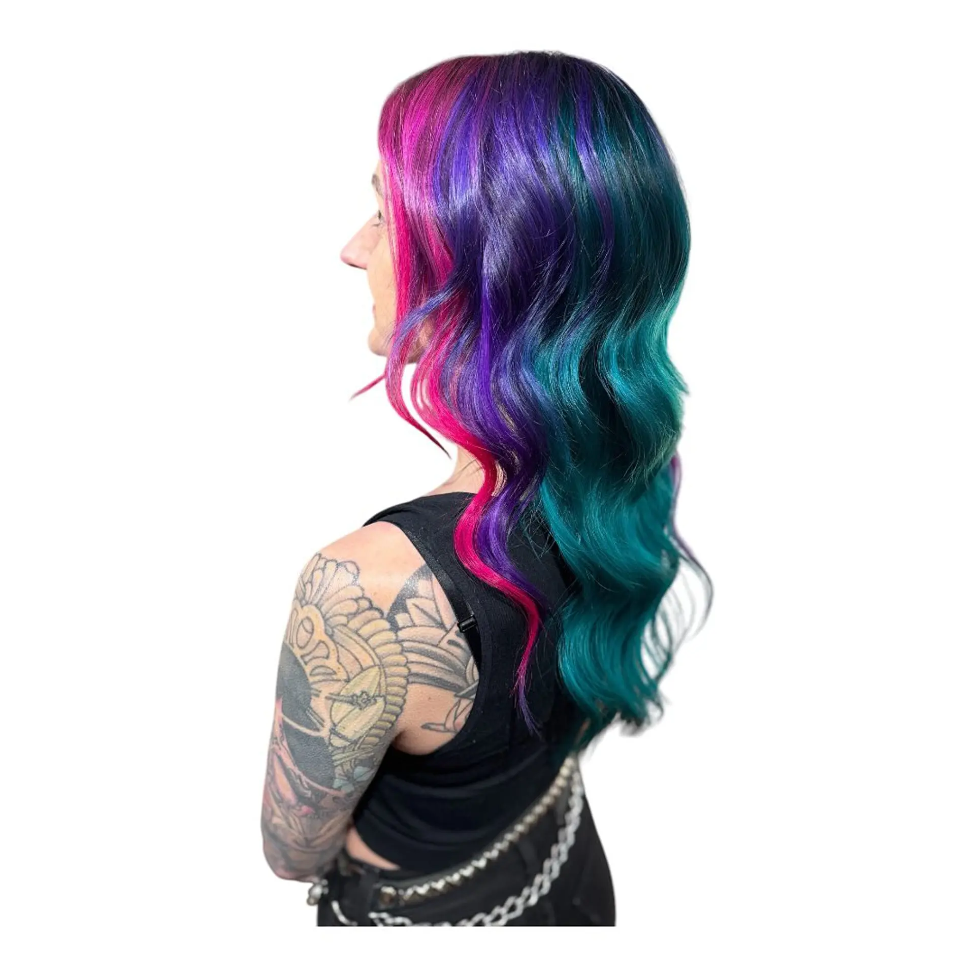 Long wavy hair with a vibrant vivid color split/melt featuring magenta pink, deep purple, and teal blue. 1