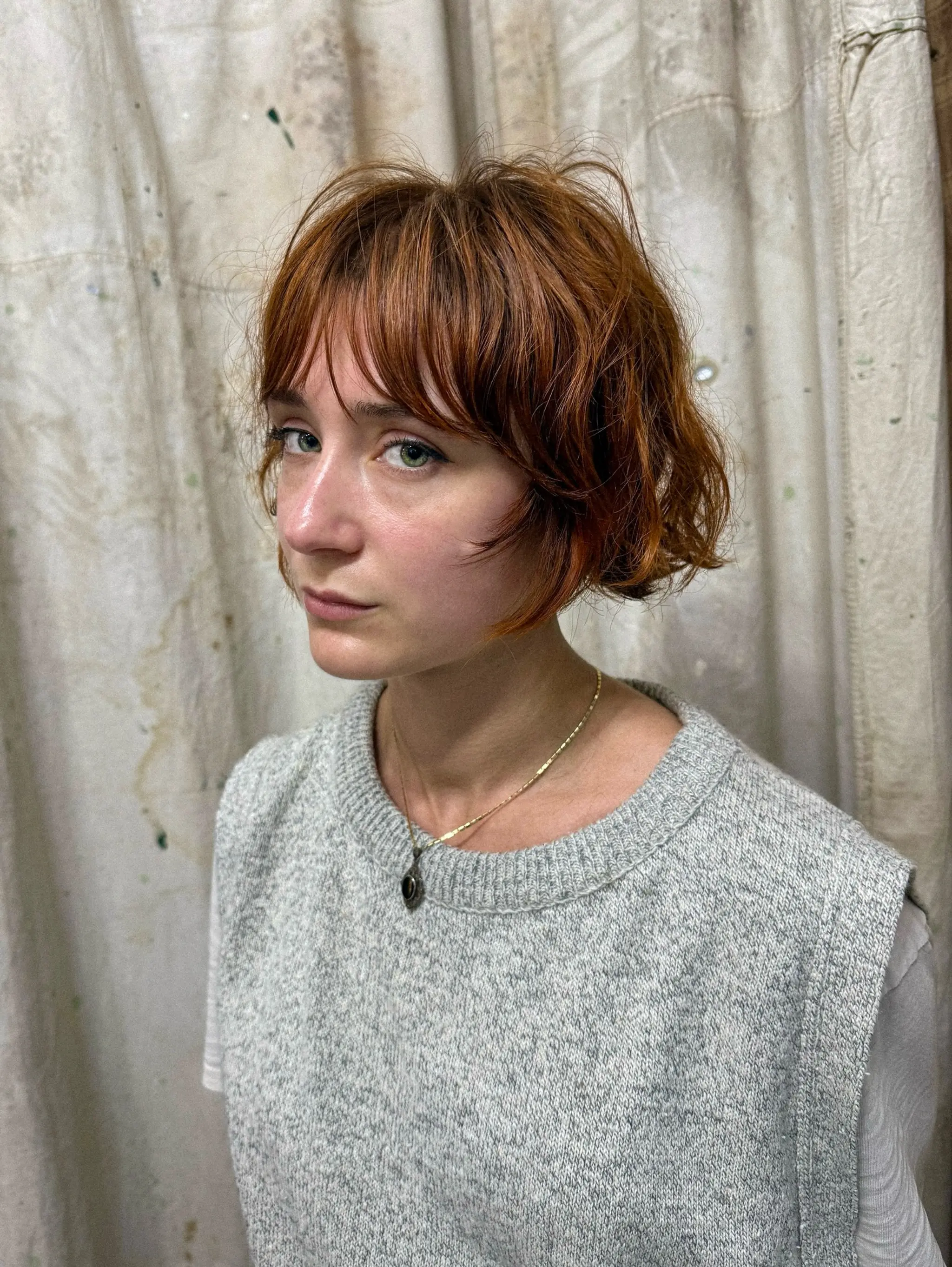 A shaggy, textured bob with soft bangs and choppy layers. 1