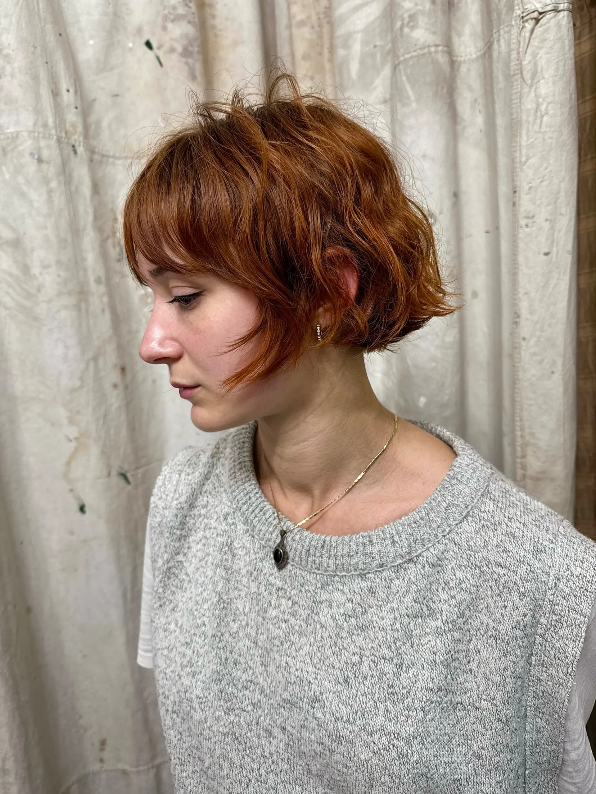 A shaggy, textured bob with soft bangs and choppy layers. 2