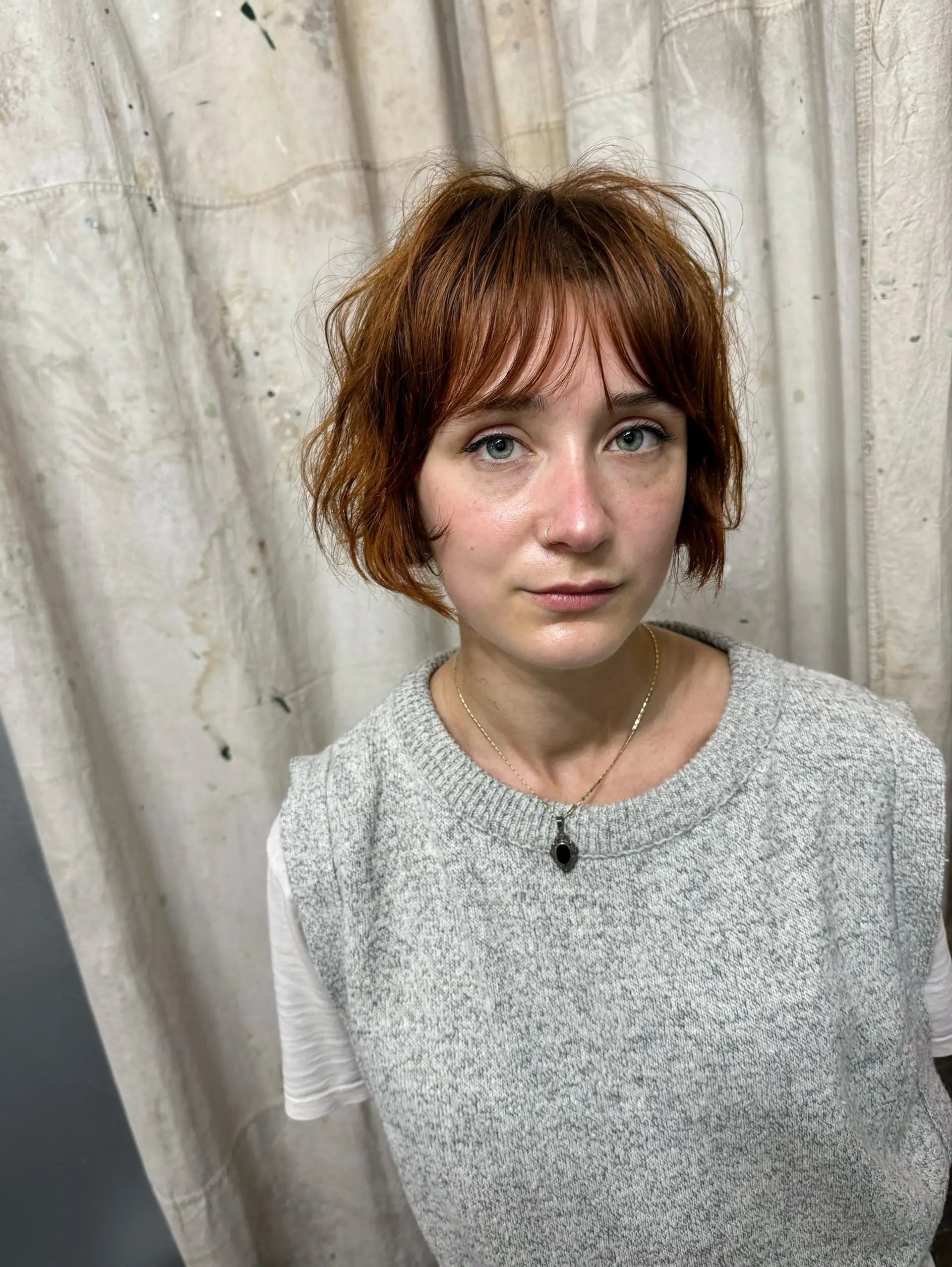 A shaggy, textured bob with soft bangs and choppy layers. 4