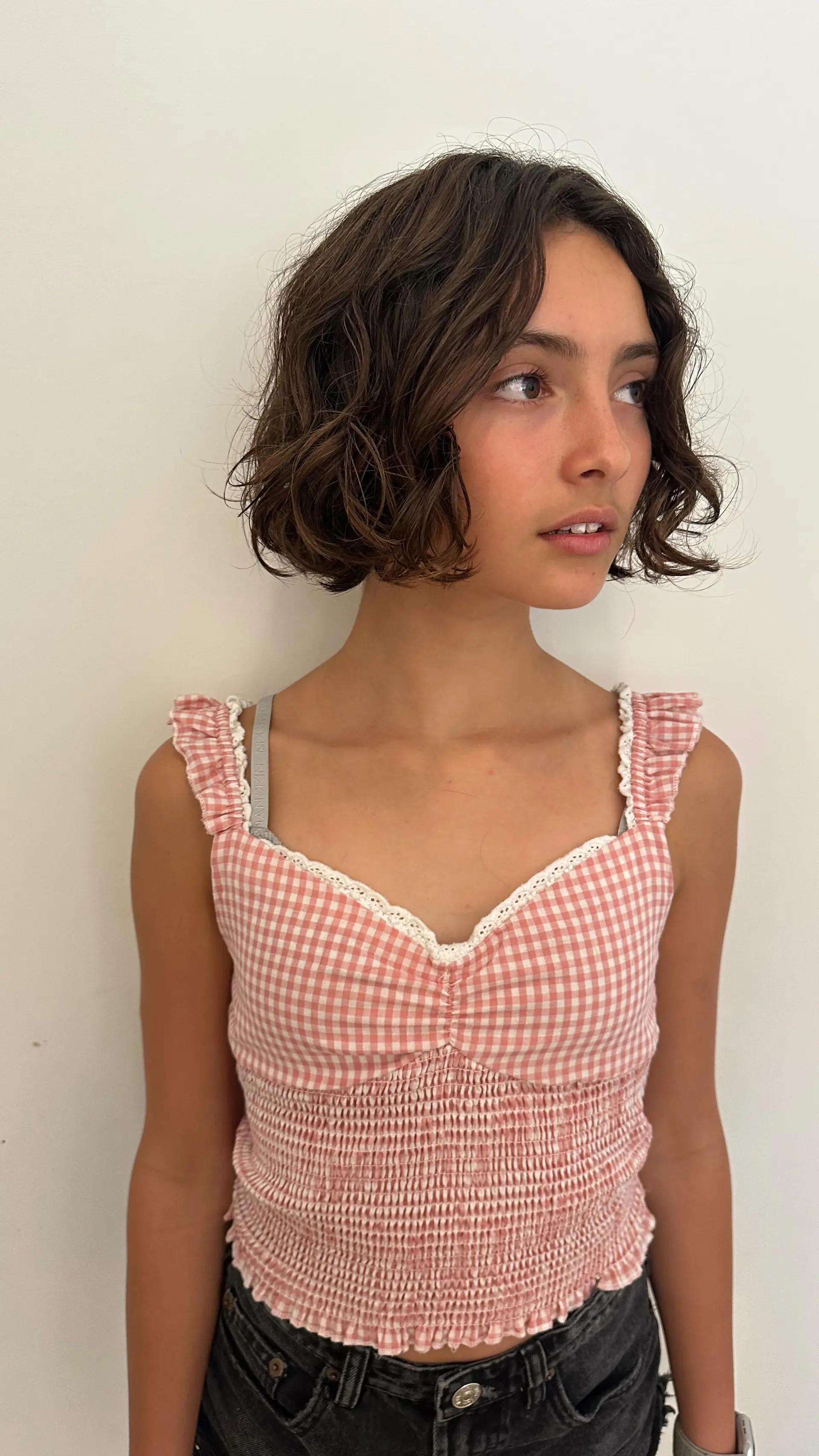 A chin-length textured French bob with loose waves and effortless volume. 1
