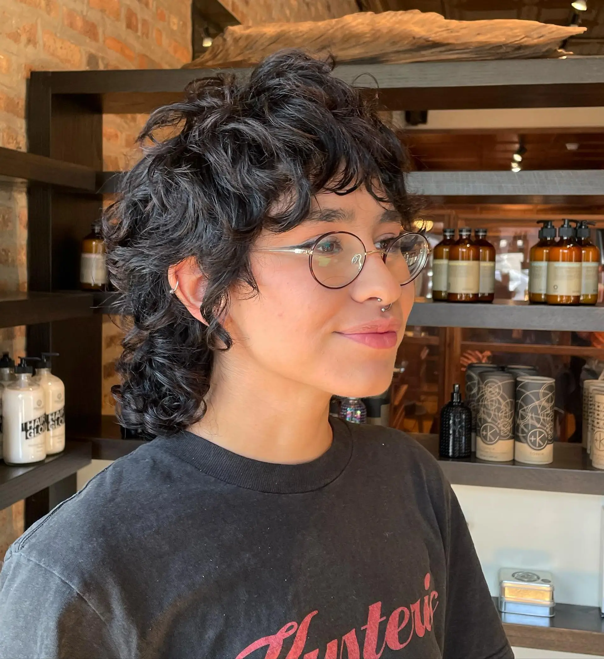 A modern curly shag mullet with lots of texture and layers. 1