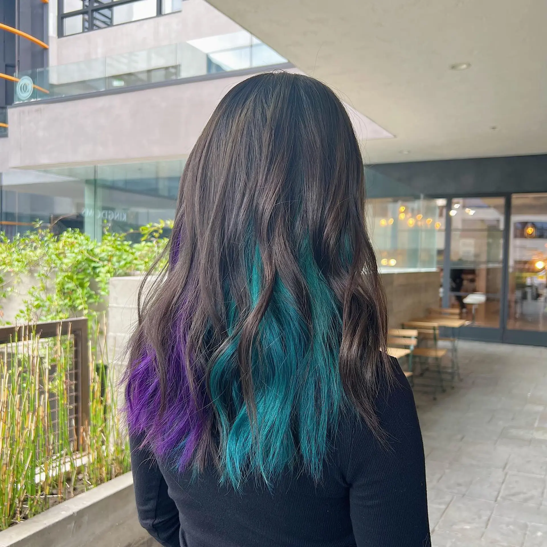 Long wavy hair with a dip dye effect in purple and teal. 2