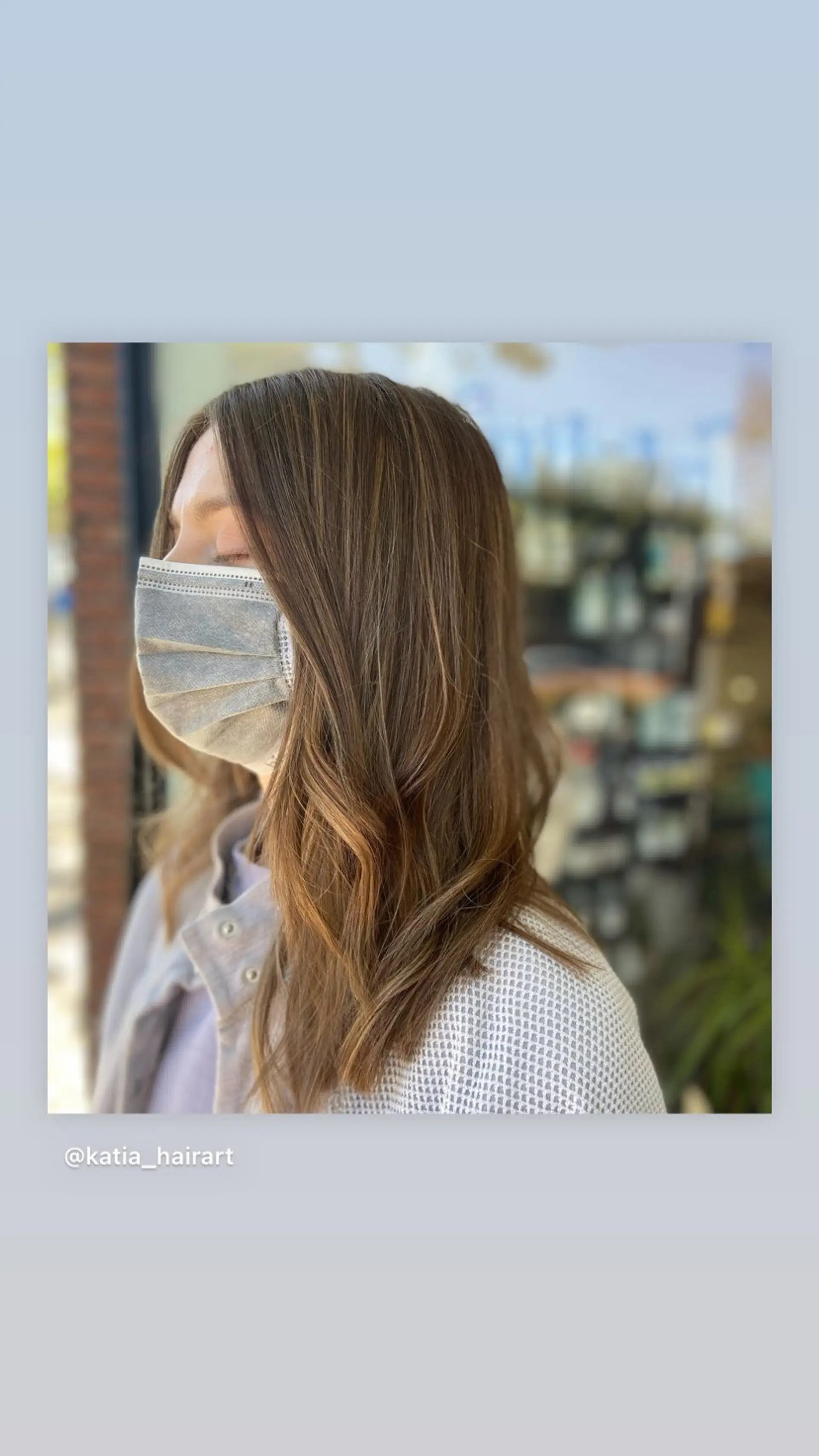 A beautiful balayage with caramel highlights that create a swirl of color and a glossy finish. The hair is medium-length with subtle layers for movement. 1