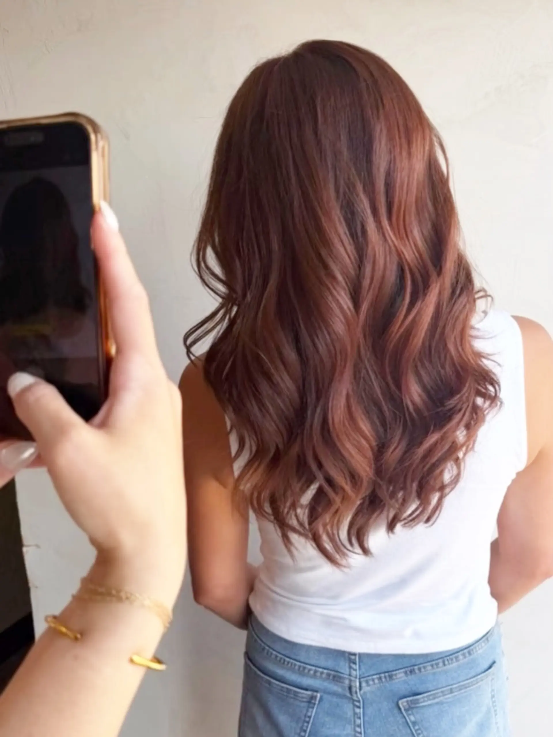 Long dimensional cinnamon copper hair styled in soft, loose waves. 1
