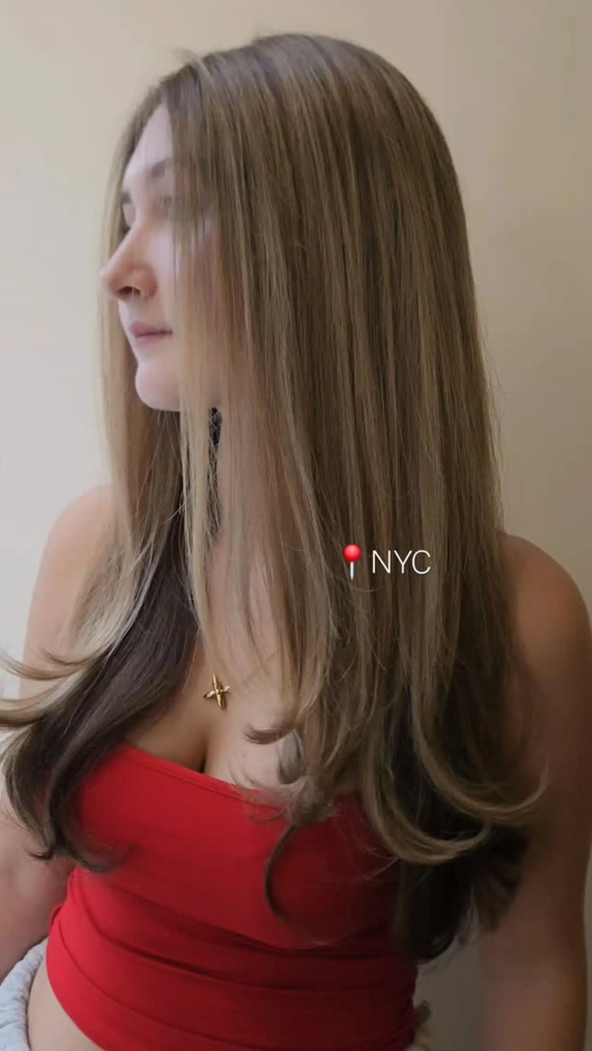Long, glossy ash-toned light brown hair cut with soft face-framing layers and styled with gently curved ends. 1