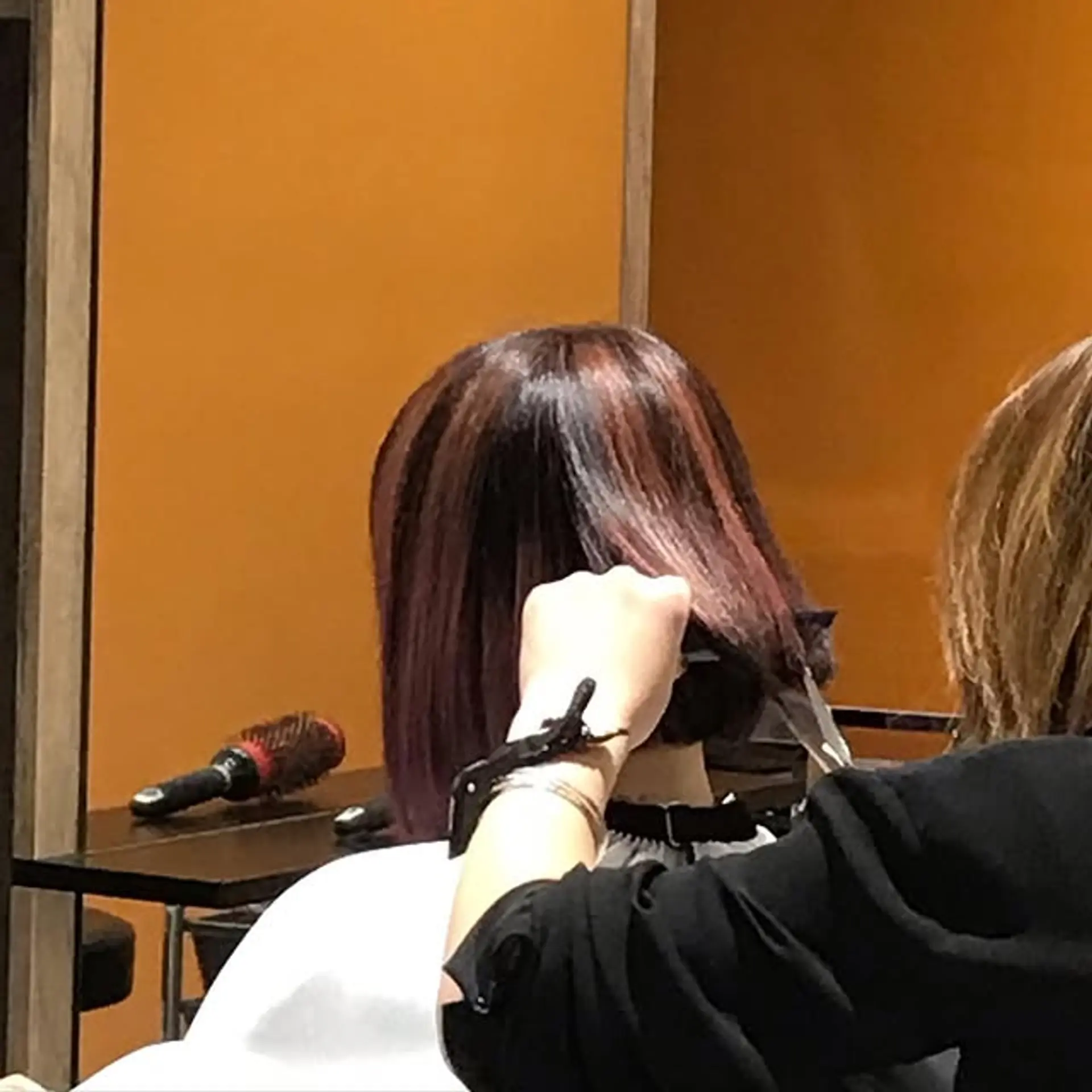 A bronzed bob with plum highlights. 1