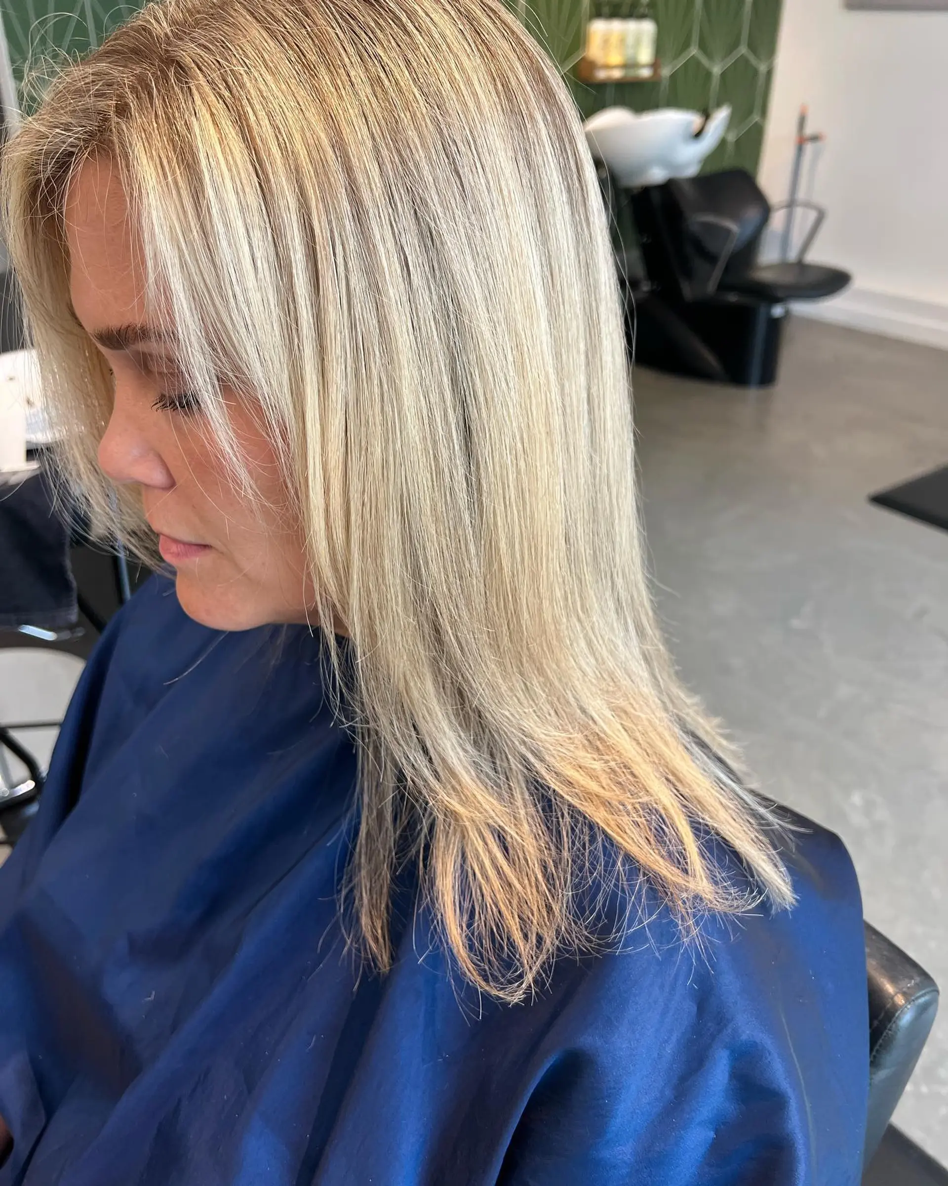 Shoulder-length straight blonde hair featuring fine, multi-tonal highlights and soft face-framing layers. 1
