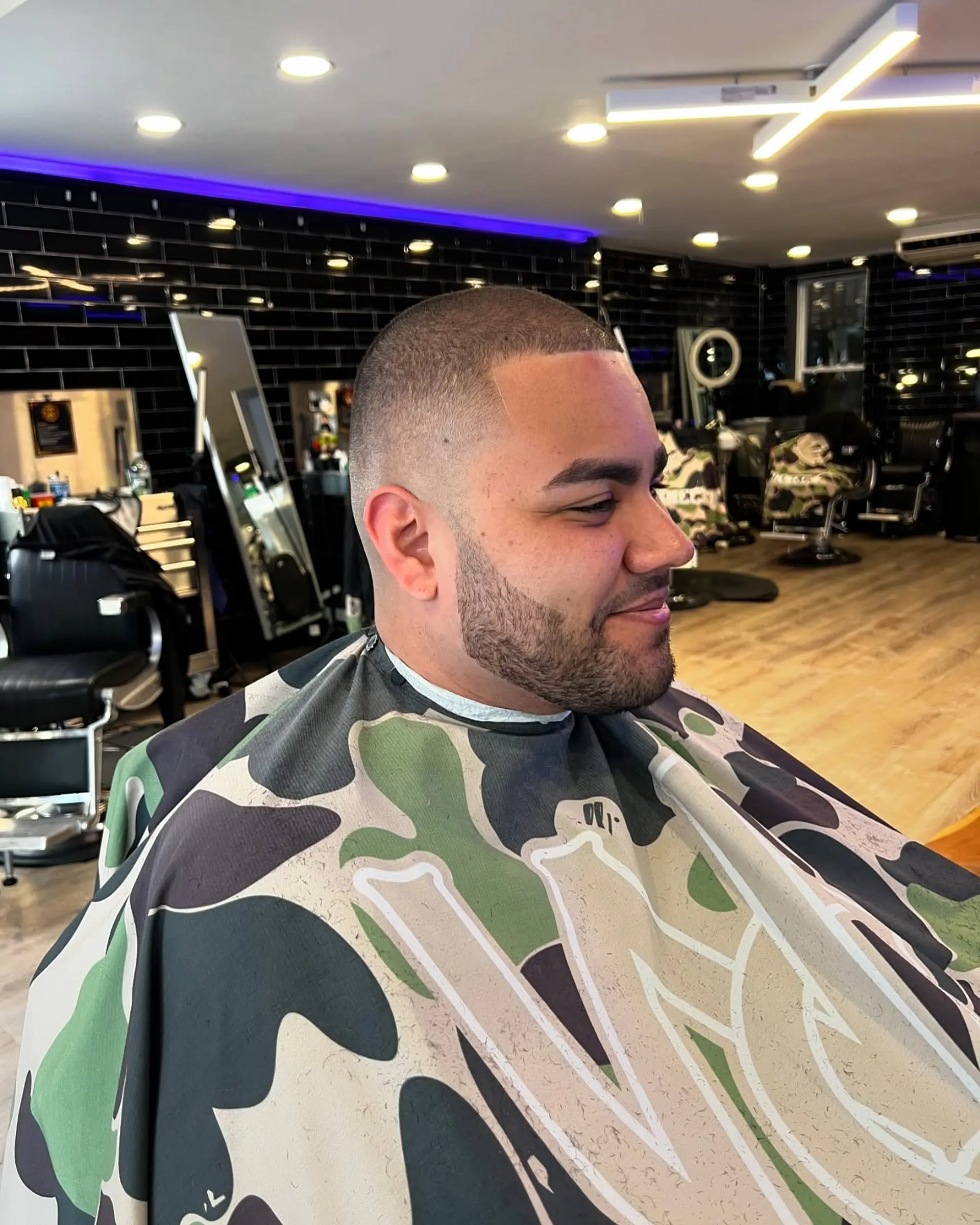 A clean buzz cut paired with a seamless high skin fade and sharp line-up. 1