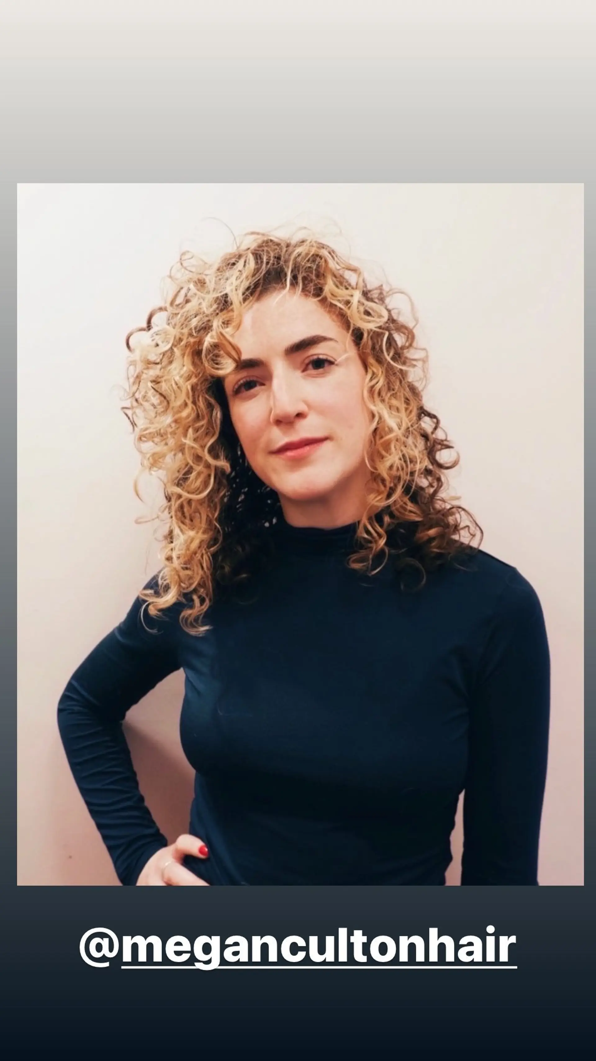 A bouncy, curly bob with layered blonde highlights for added dimension. 1