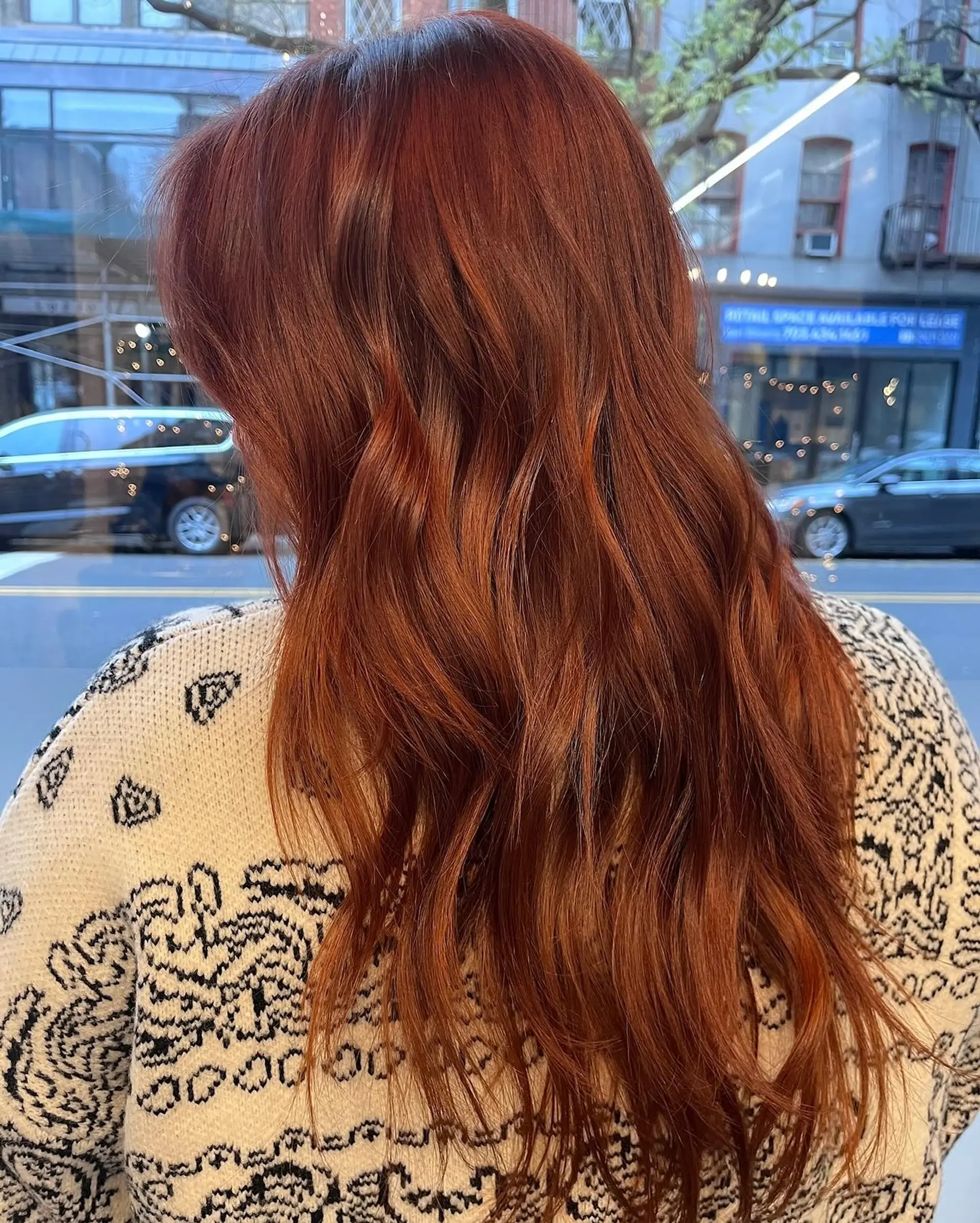 Long vibrant copper-auburn hair with soft layers and relaxed, tousled waves. 1