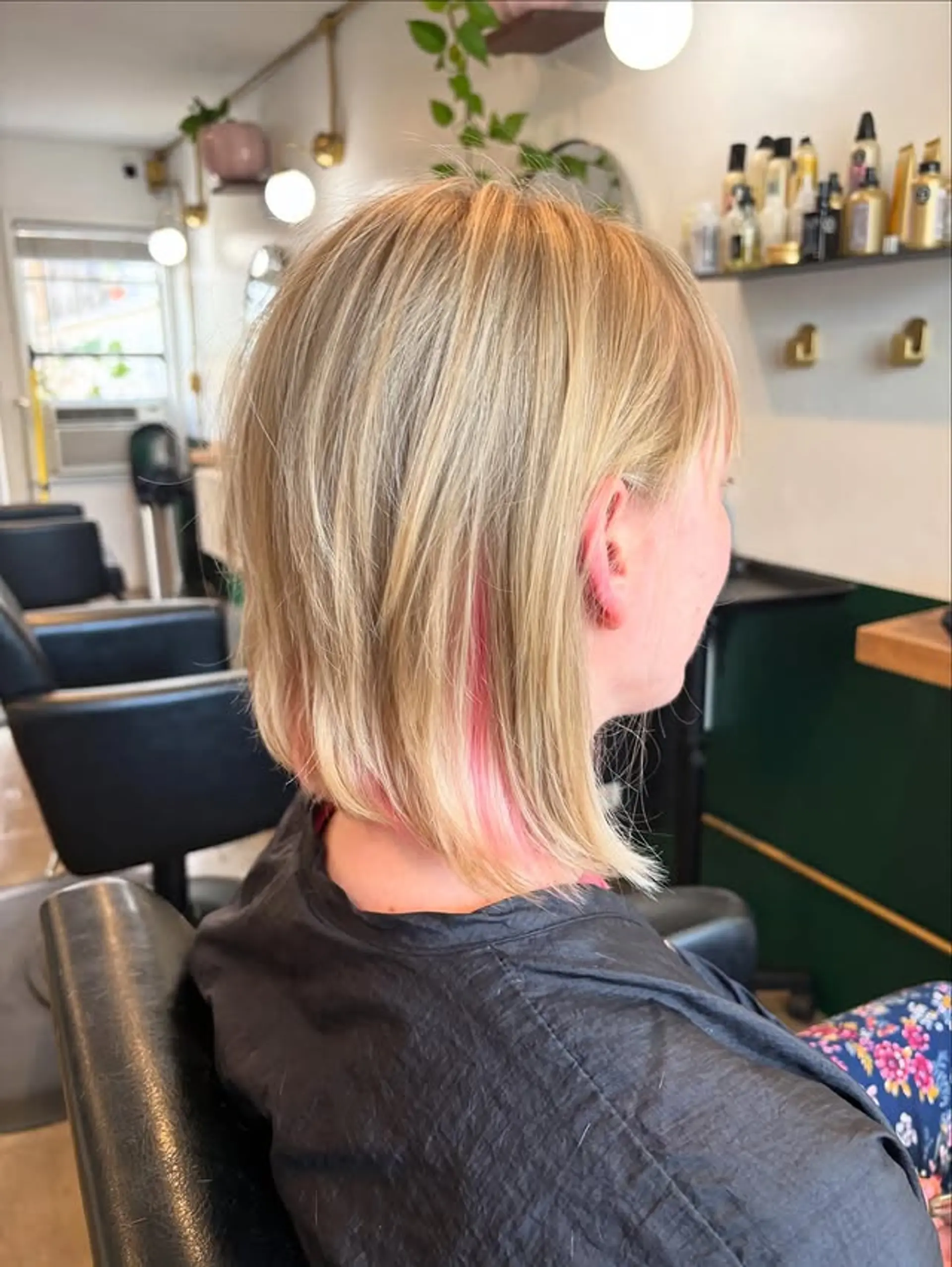 A chic, textured bob with subtle pink highlights. 1