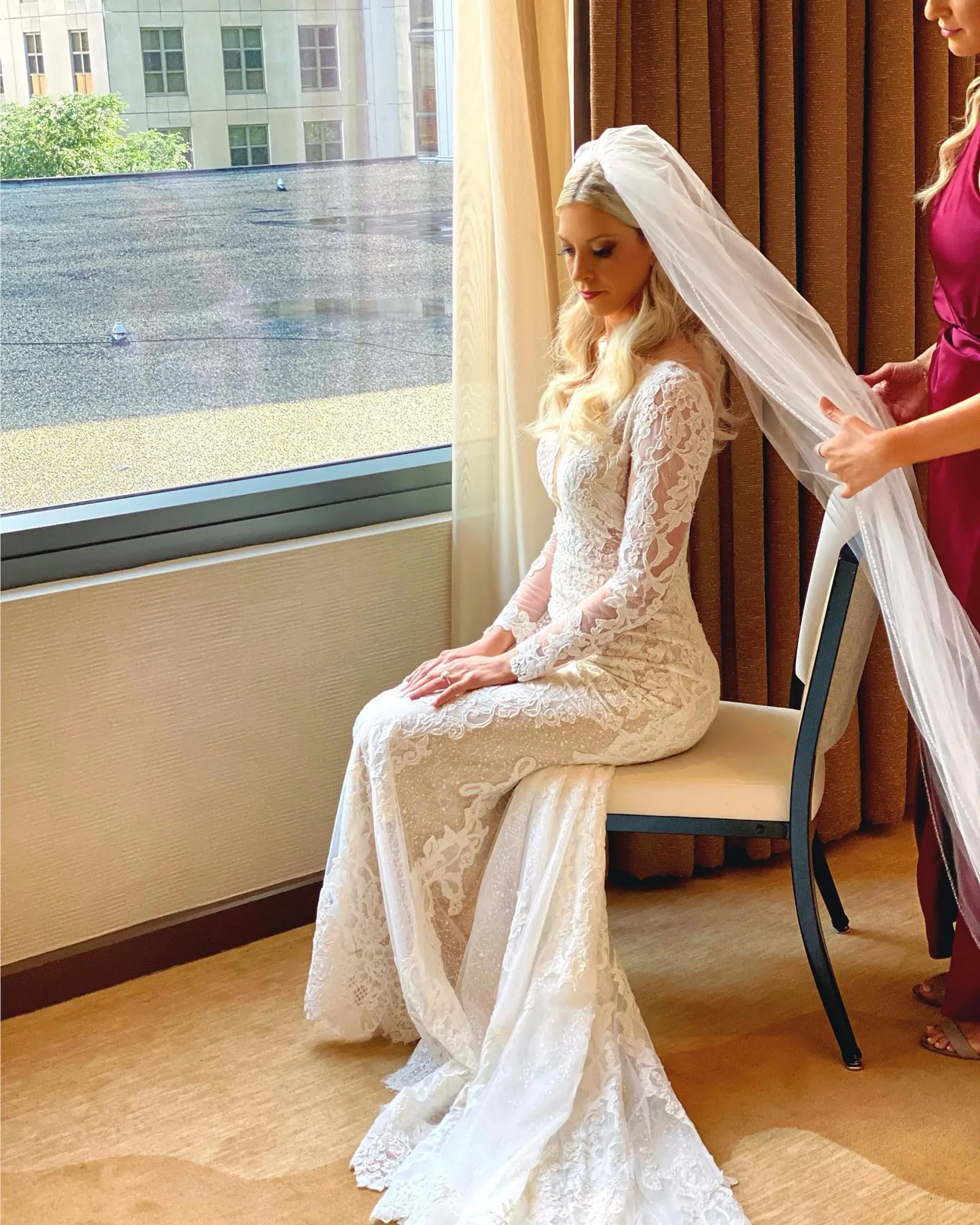 Long blonde hair styled in soft glamorous waves for a bridal look. 1