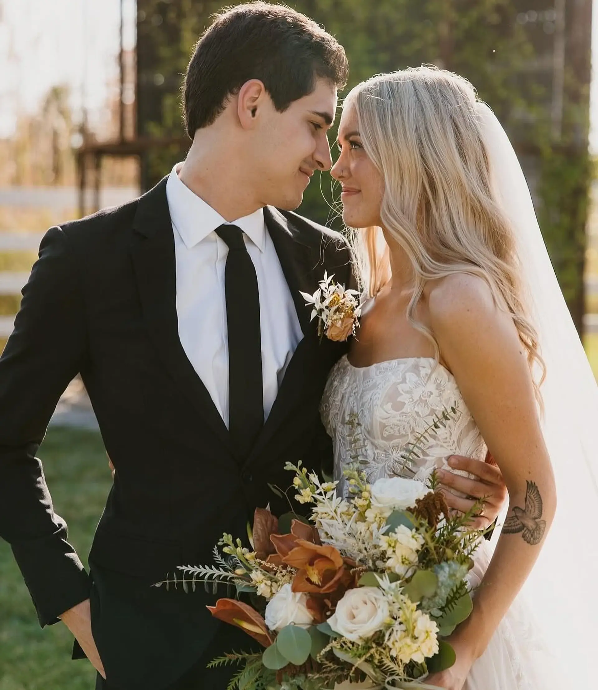 Long, luminous blonde hair styled into soft, elegant waves for a classic bridal look. 1
