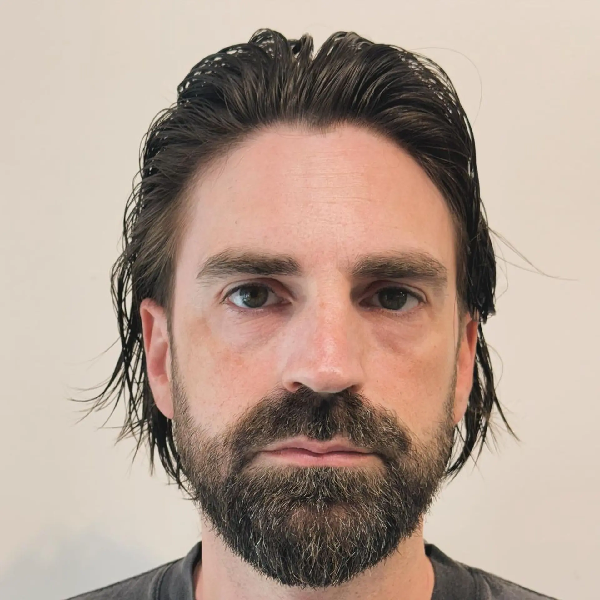 Medium-length, dark brown wavy hair with a sleek, wet look featuring layered, side-swept styling and neck-length cut. 3