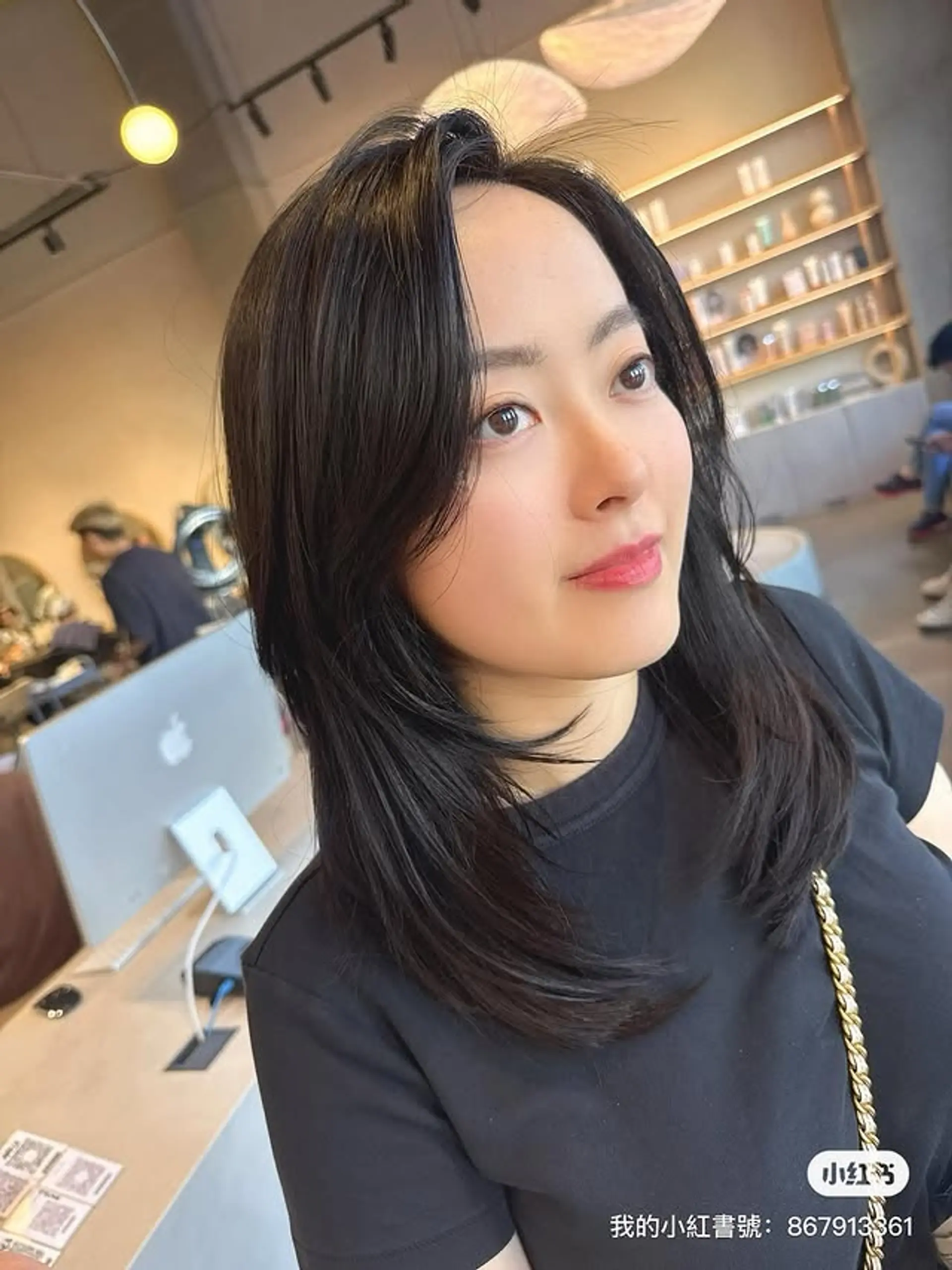 A layered medium length cut with face-framing layers and see-through bangs. 1