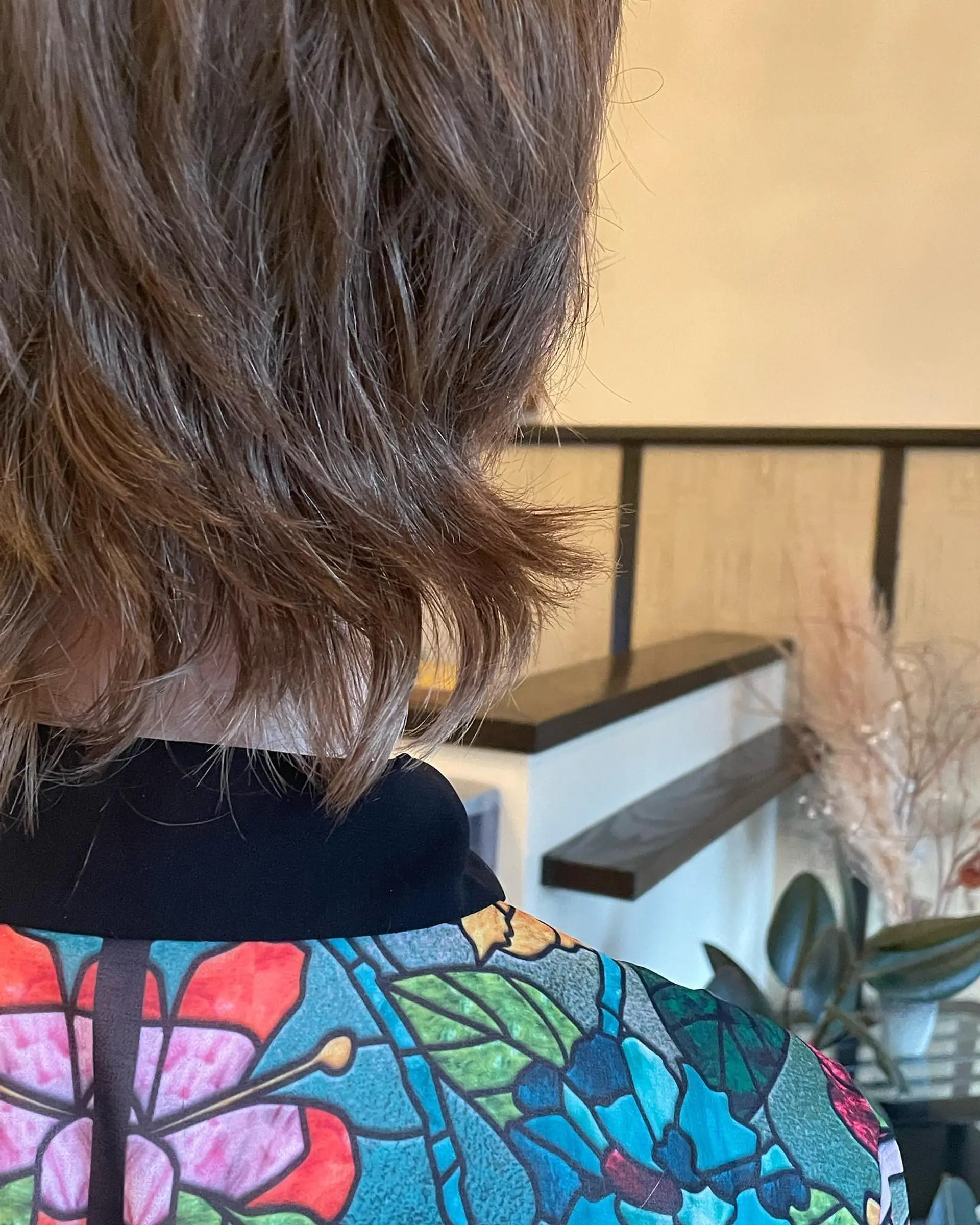 This hairstyle features a short, shaggy pixie cut with mullet-like layers at the back. 2